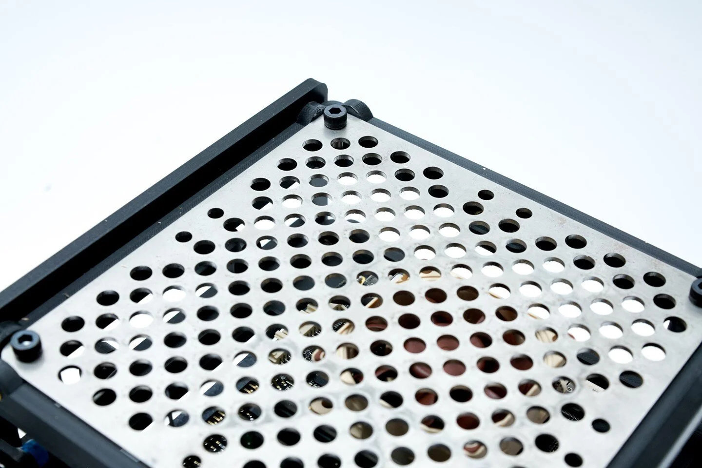 With this iteration I have removed the monitor mount and replaced simply added this cut top to keep stuff from falling in.  The holes were already in the original design, so no new parts were needed for this update.