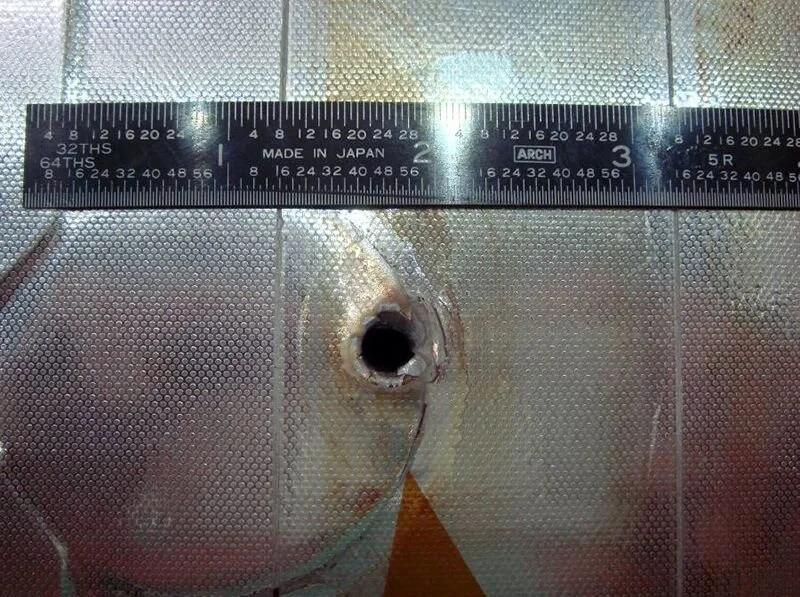 Damage to the Space Shuttle Endeavour from a collision with piece of space debris or a micrometeorite.Credit: NASA