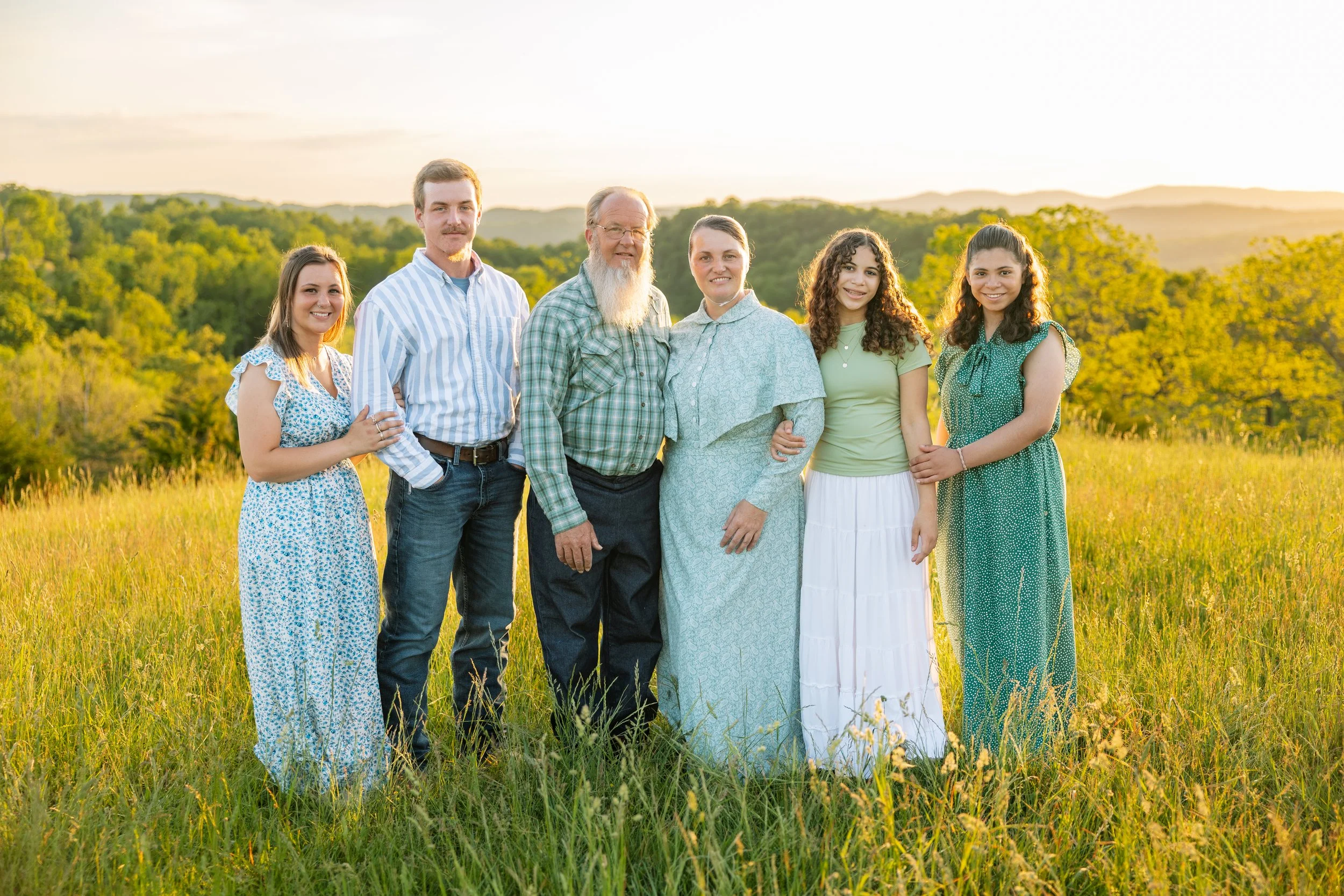 The Laurel Creek Soaps family standing together in a field at sunset
