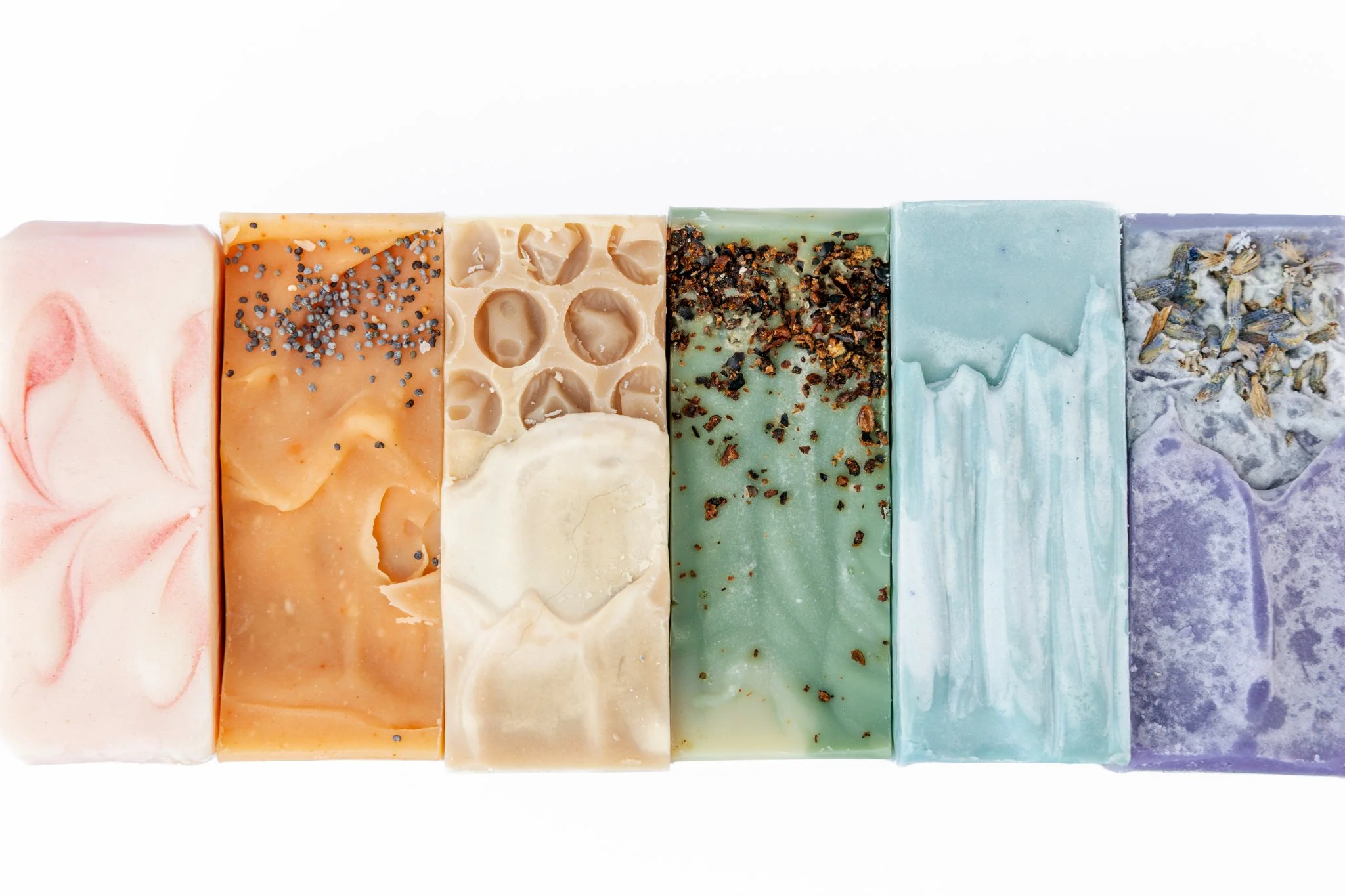 A variety of hand made soaps of various colors and textures during a Tampa, FL product photography session