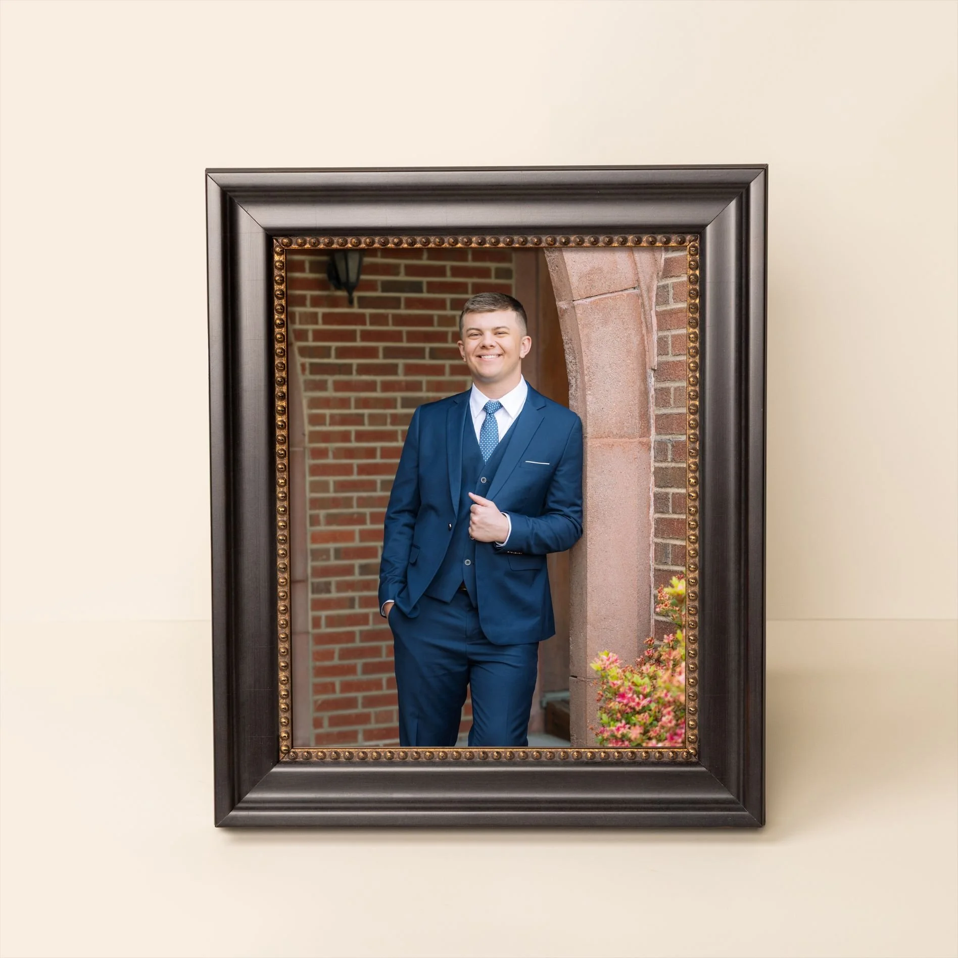 A framed portrait of a male senior posing during a Tampa, FL senior photo session.