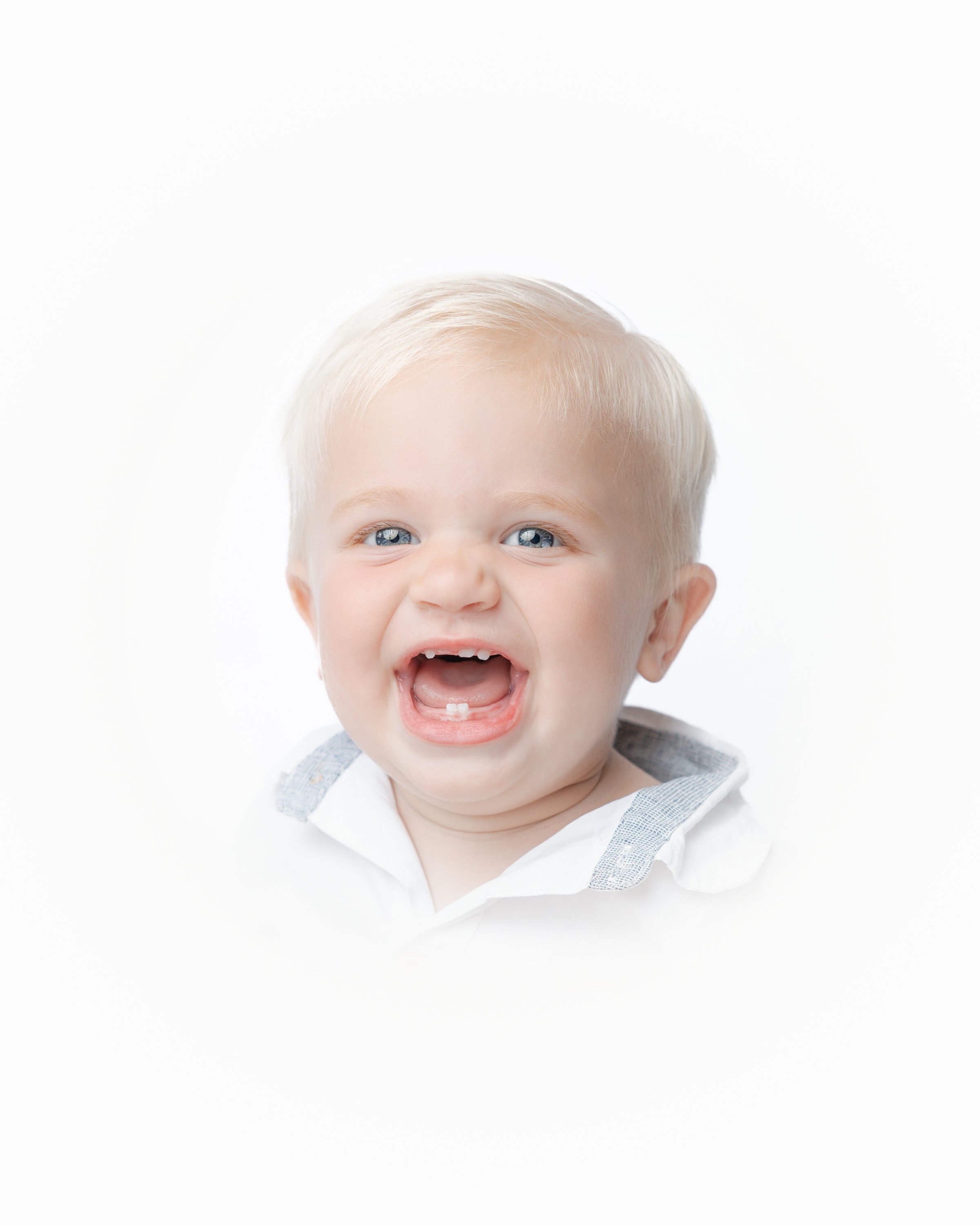 Heirloom portrait of a smiling one year old boy in Tampa, FL.