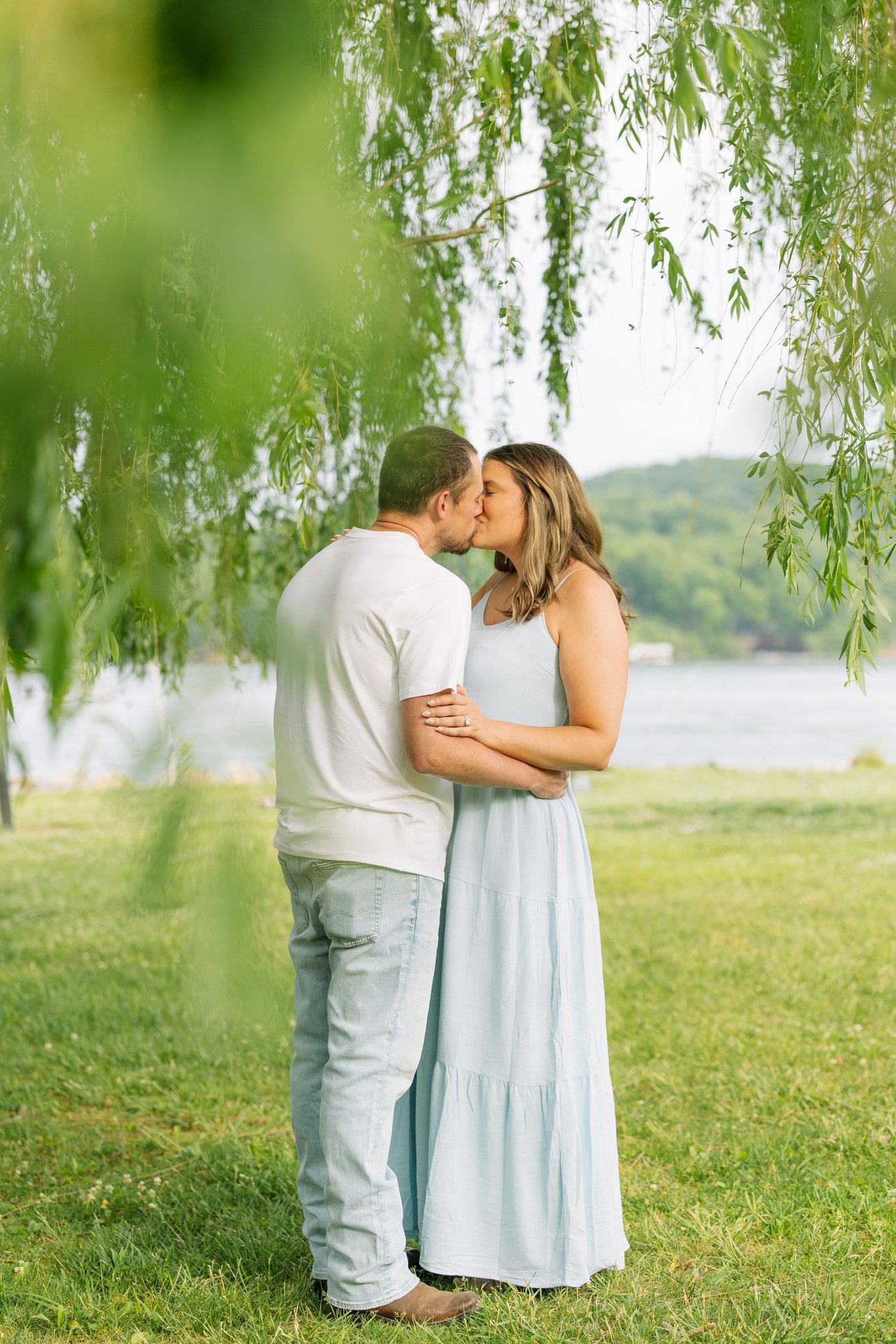 A couple embracing with a kiss during a Tampa, FL engagement session.