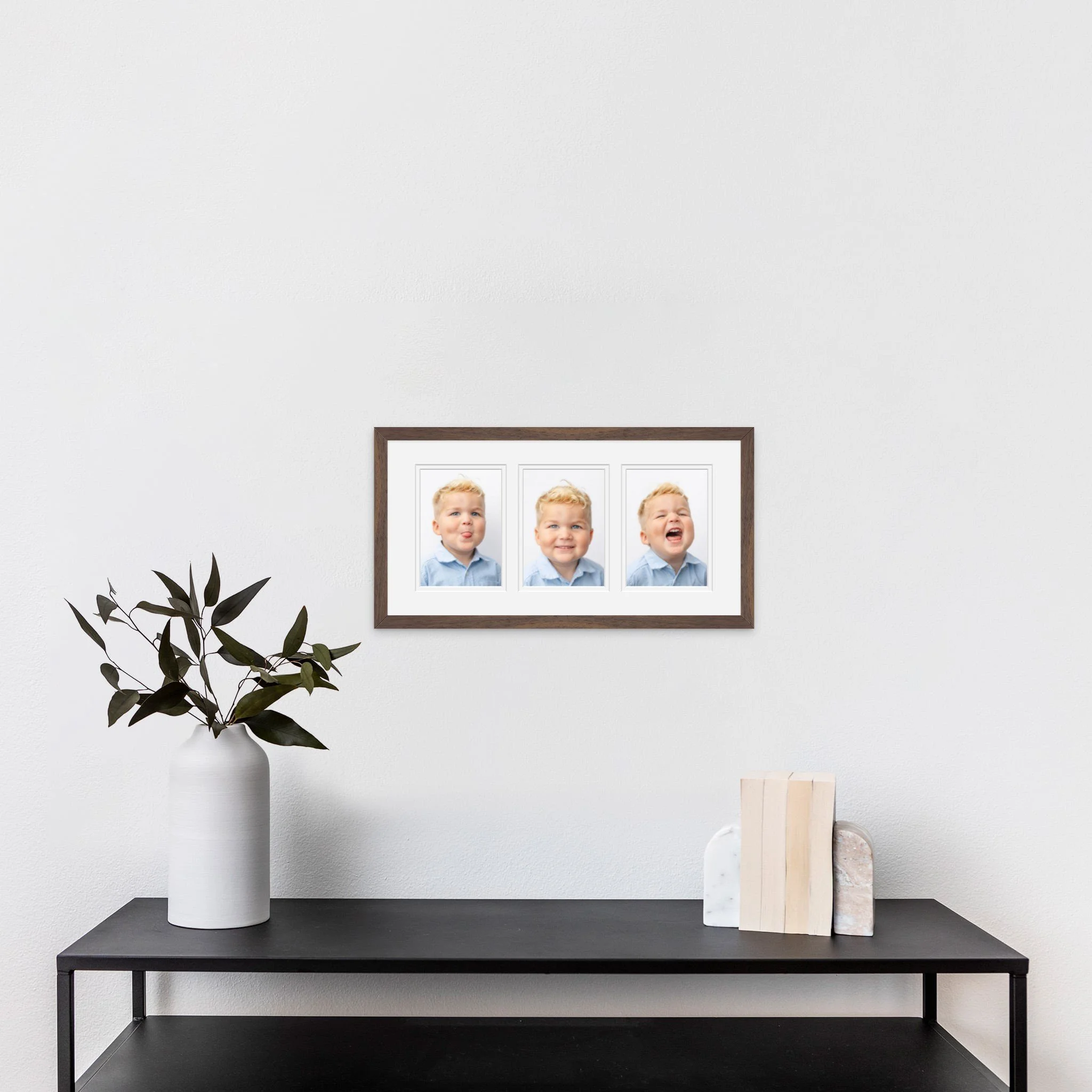 Framed collage of heirloom portraits in Tampa, FL home.