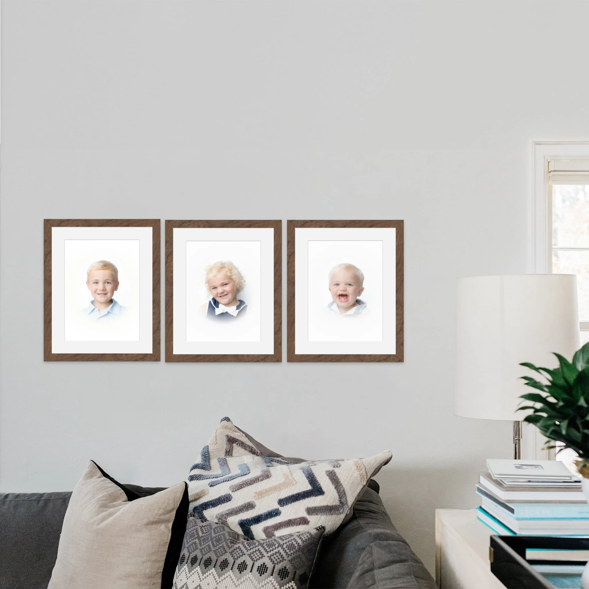 Framed heirloom portraits of 3 children hanging on the wall in a Tampa, FL home.
