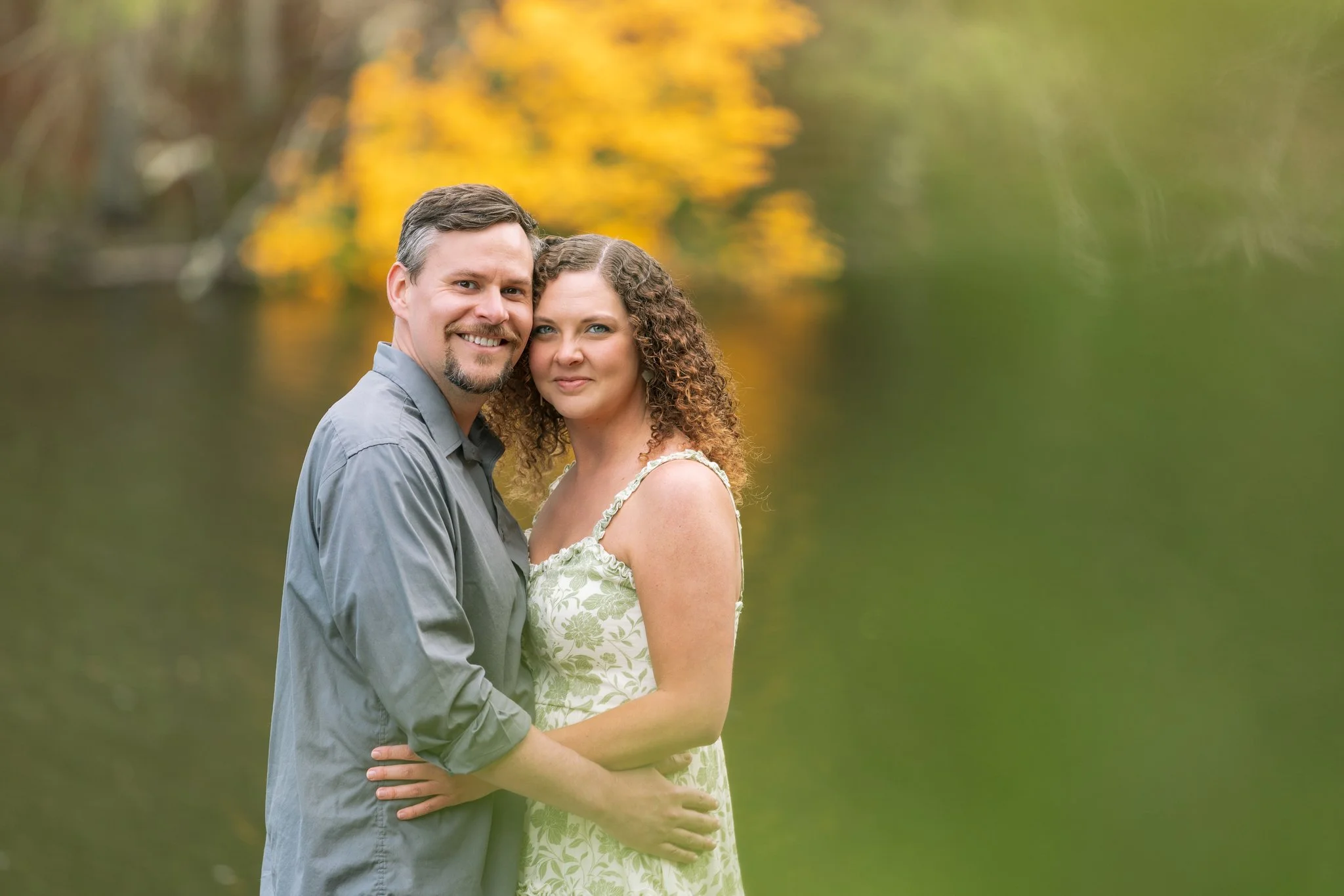 A photo of a couple embracing and smiling for a Tampa, FL anniversary photo session