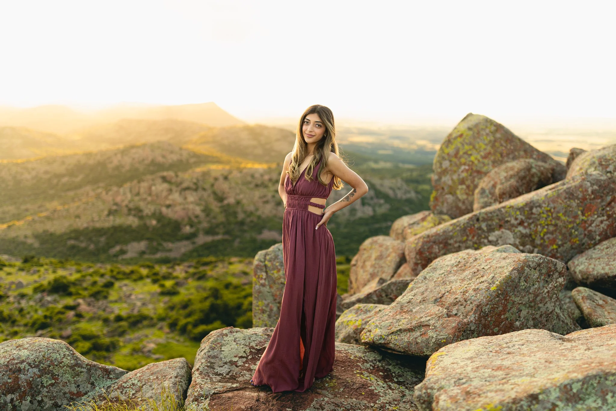 A female male posing at an overlook during a Tampa, FL senior photo session.