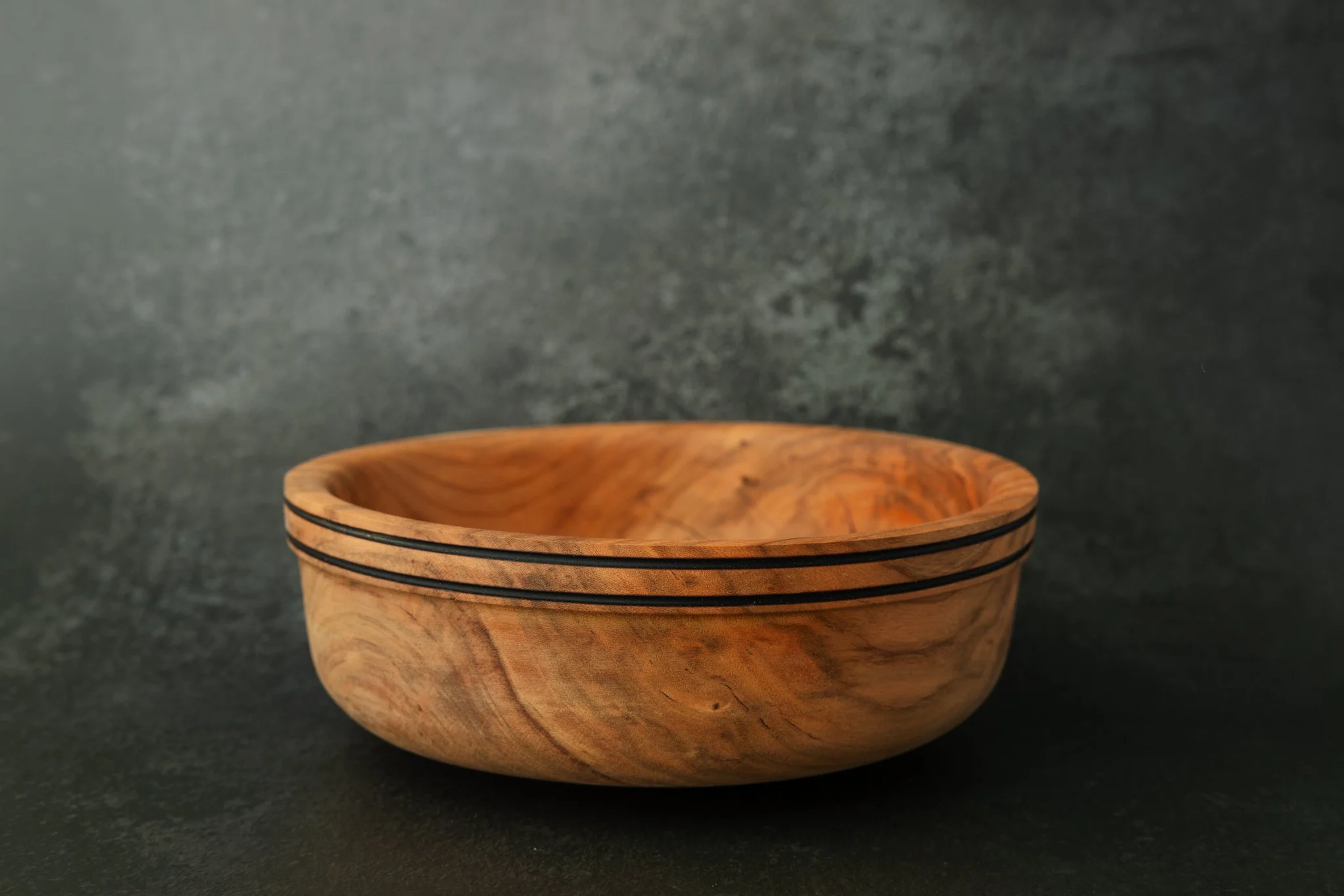 A product photo of a handmade wooden bowl for a Tampa, FL product photography session