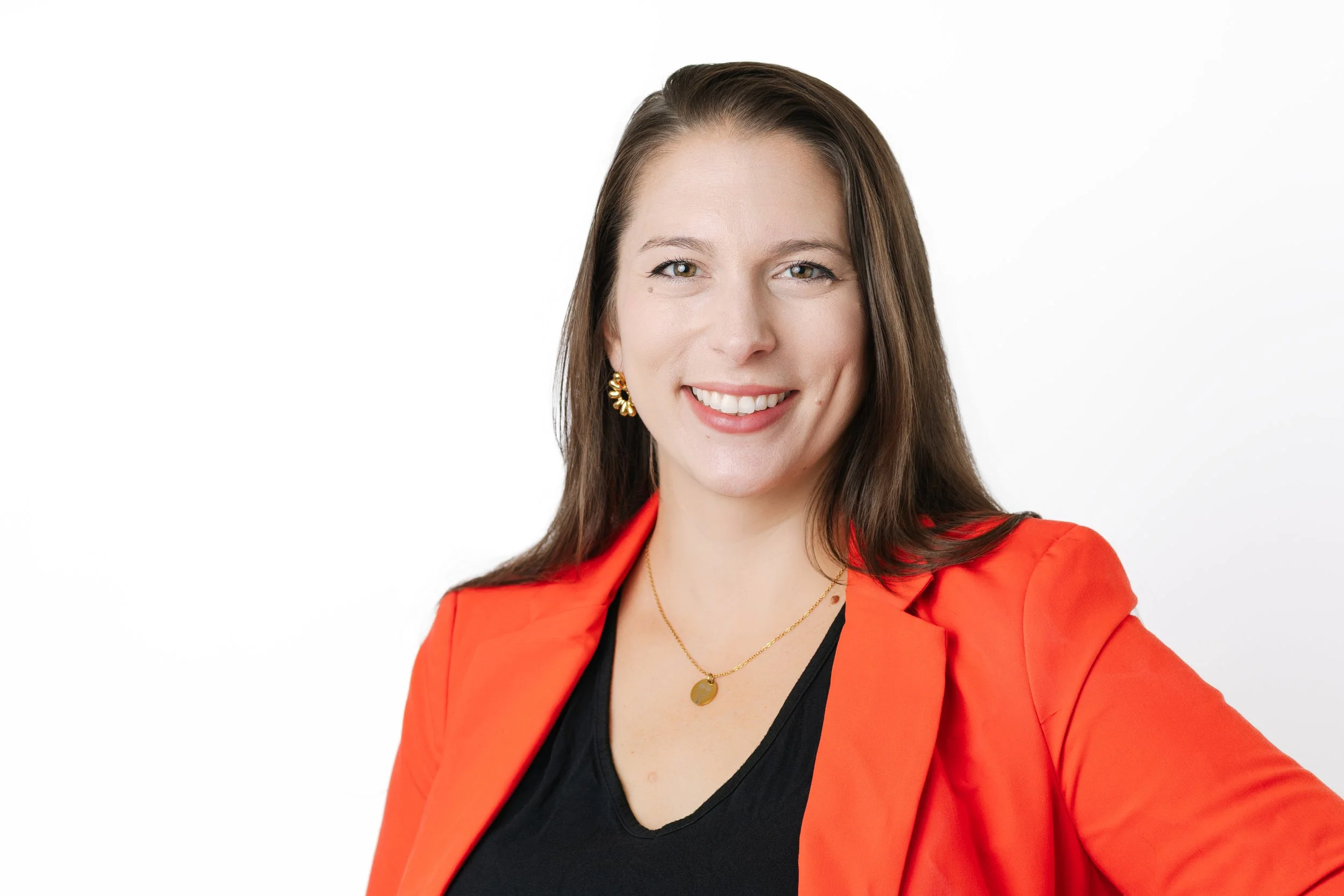 A female doctor smiling for a headshot portrait during a Tampa, FL headshot photo session.
