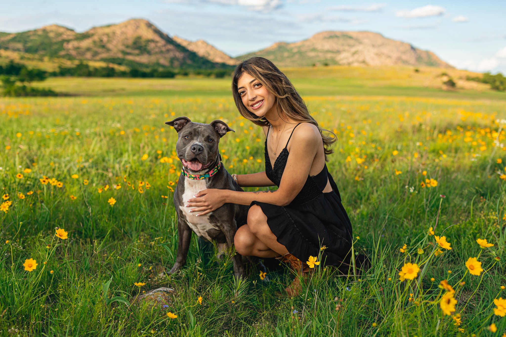 A female senior graduate posing with her dog for a Tampa, FL senior portrait.