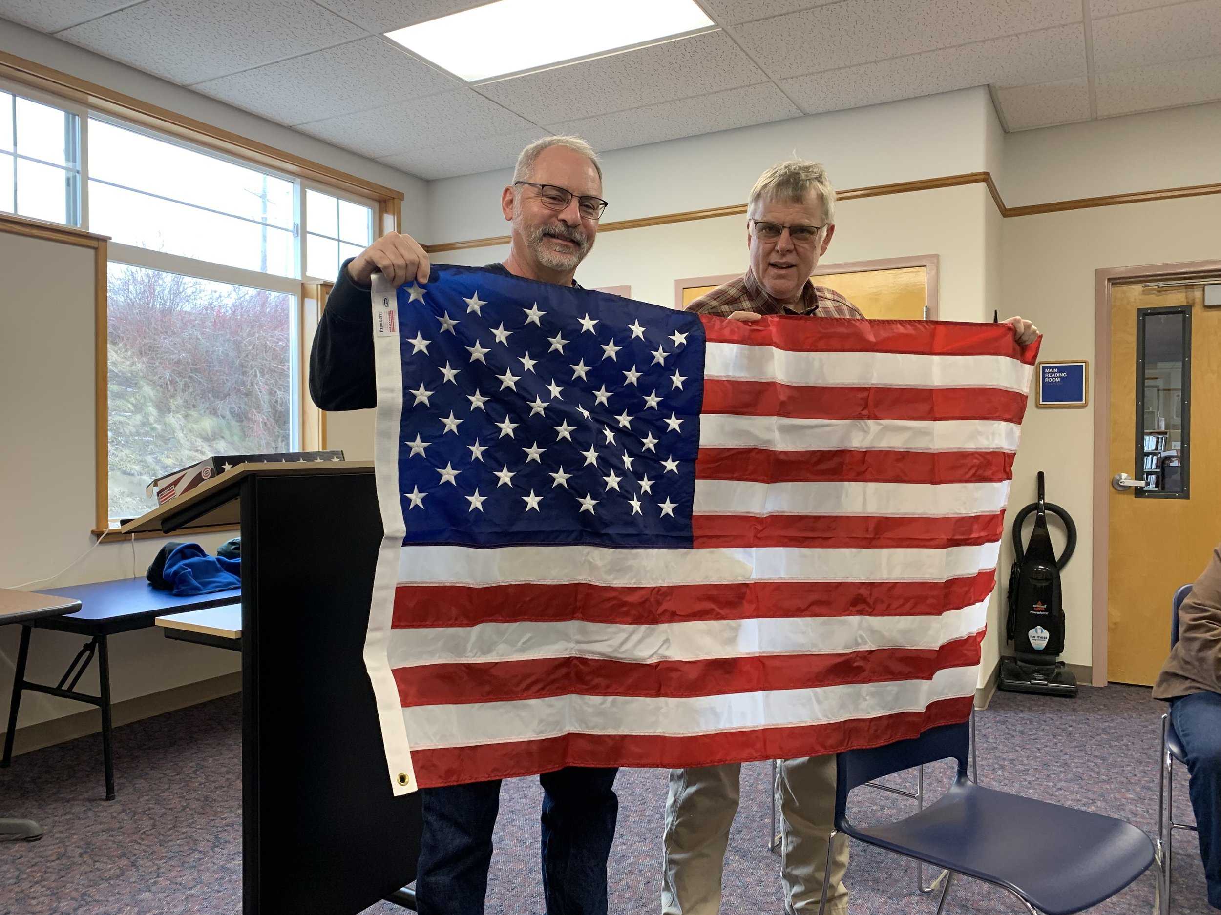 Potter and Nelson with flag in Potlatch.jpeg