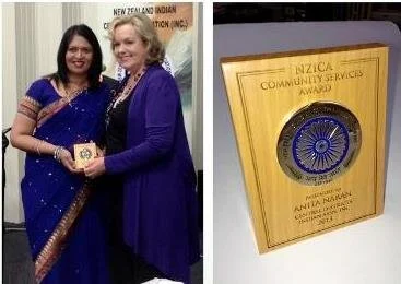 Anita Naran receiving her award from MP Judith Collins