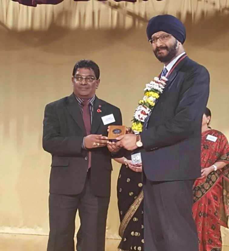 Paul Patel receiving his award from MP Kanwaljit Singh Bakshi