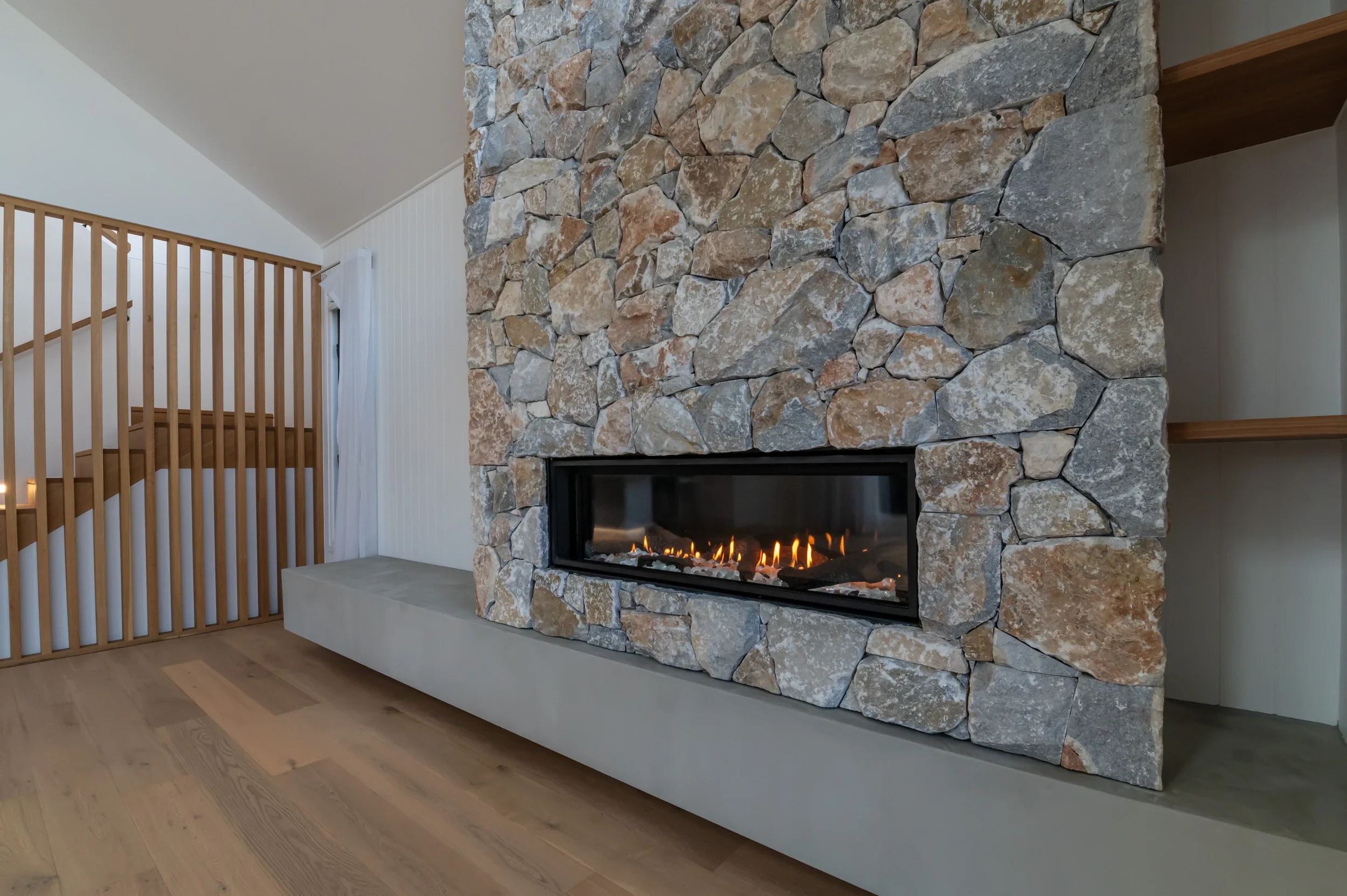 cylinders-74-kingscliff-07-stone-fireplace.webp