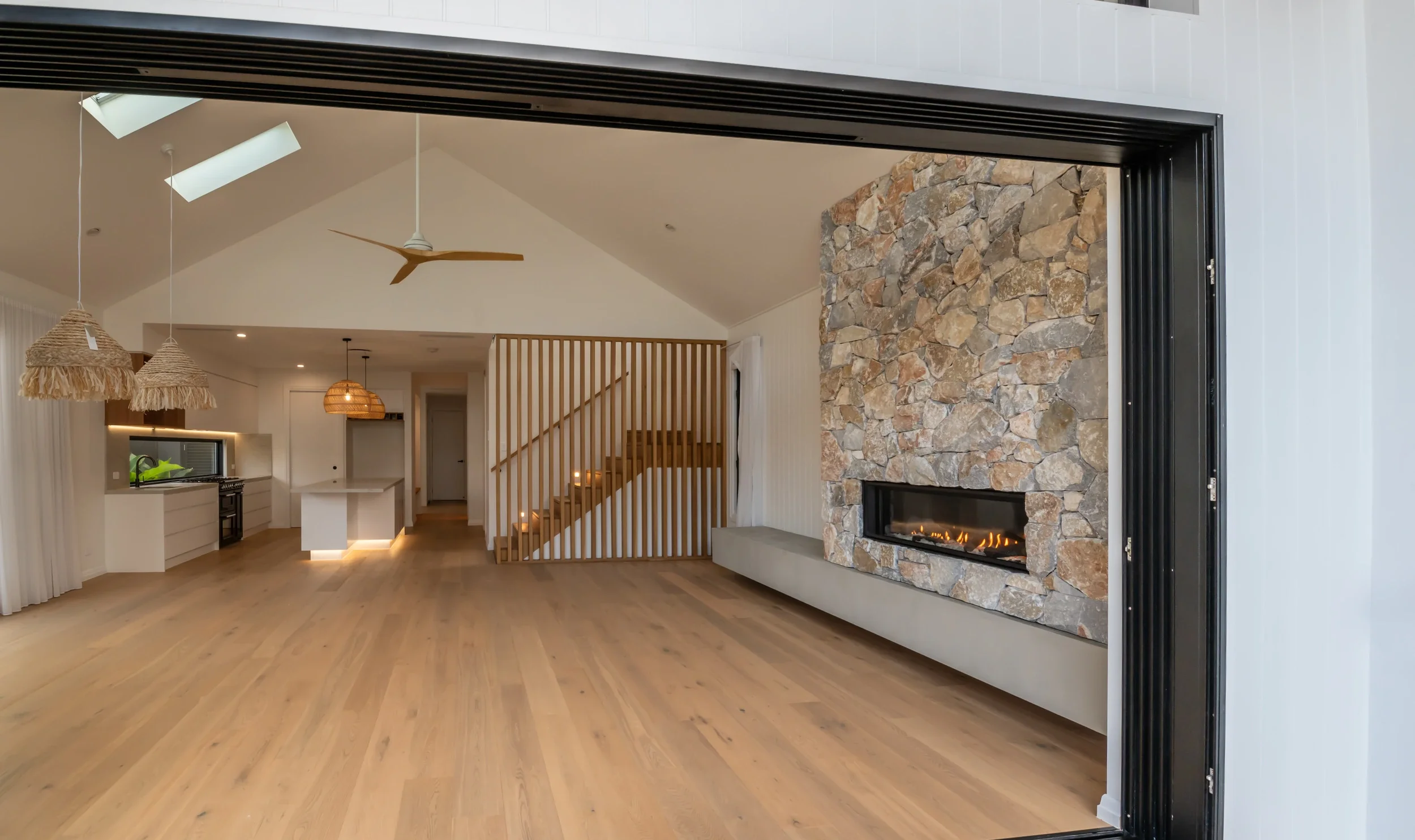 cylinders-74-kingscliff-05-living-through-glass-doors.webp