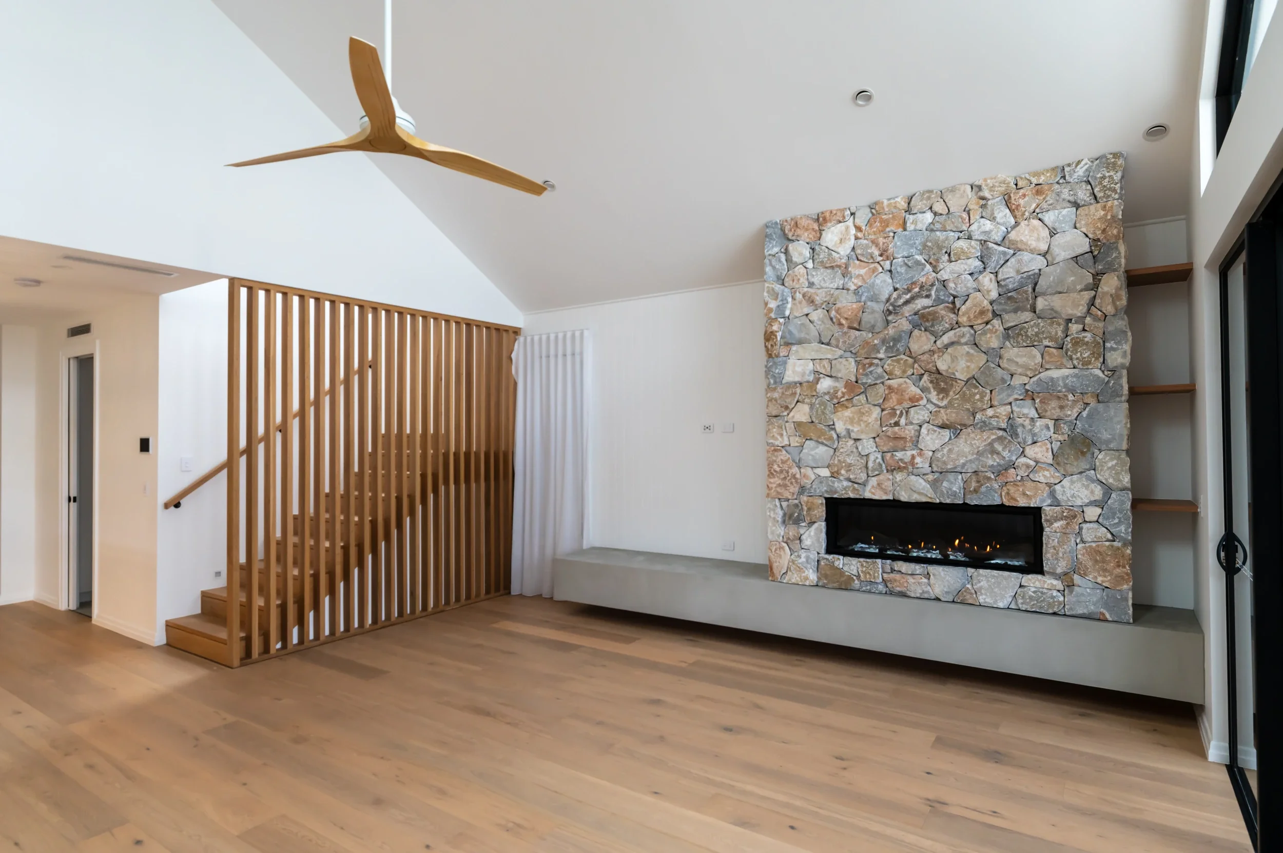 cylinders-74-kingscliff-06-living-and-fireplace.webp