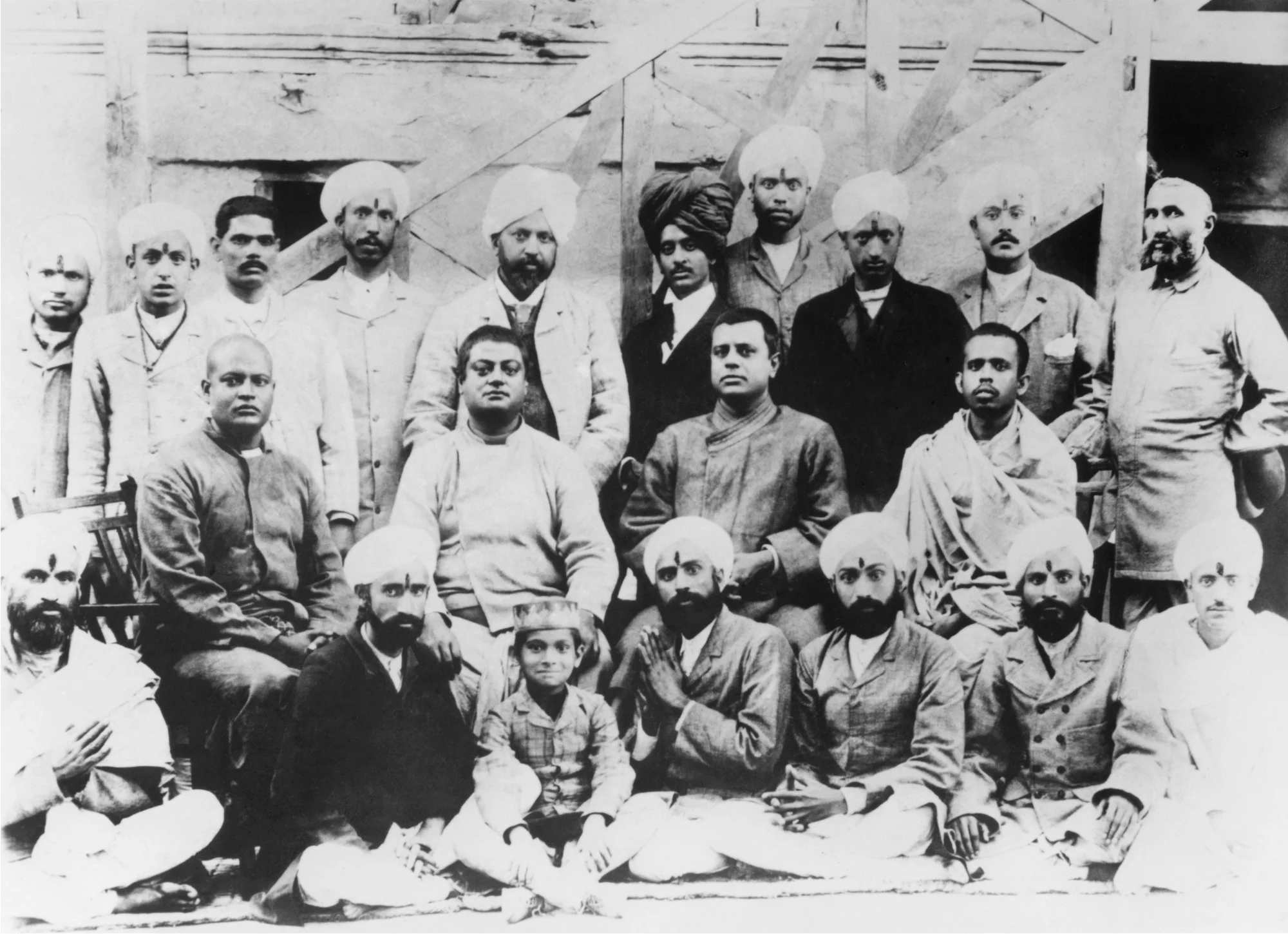 (#66) Kashmir, 1897. Sitting on chairs ( from L): Swami Sadananda, Swamiji, Swami Niranjanananda, Swami Dhirananda.