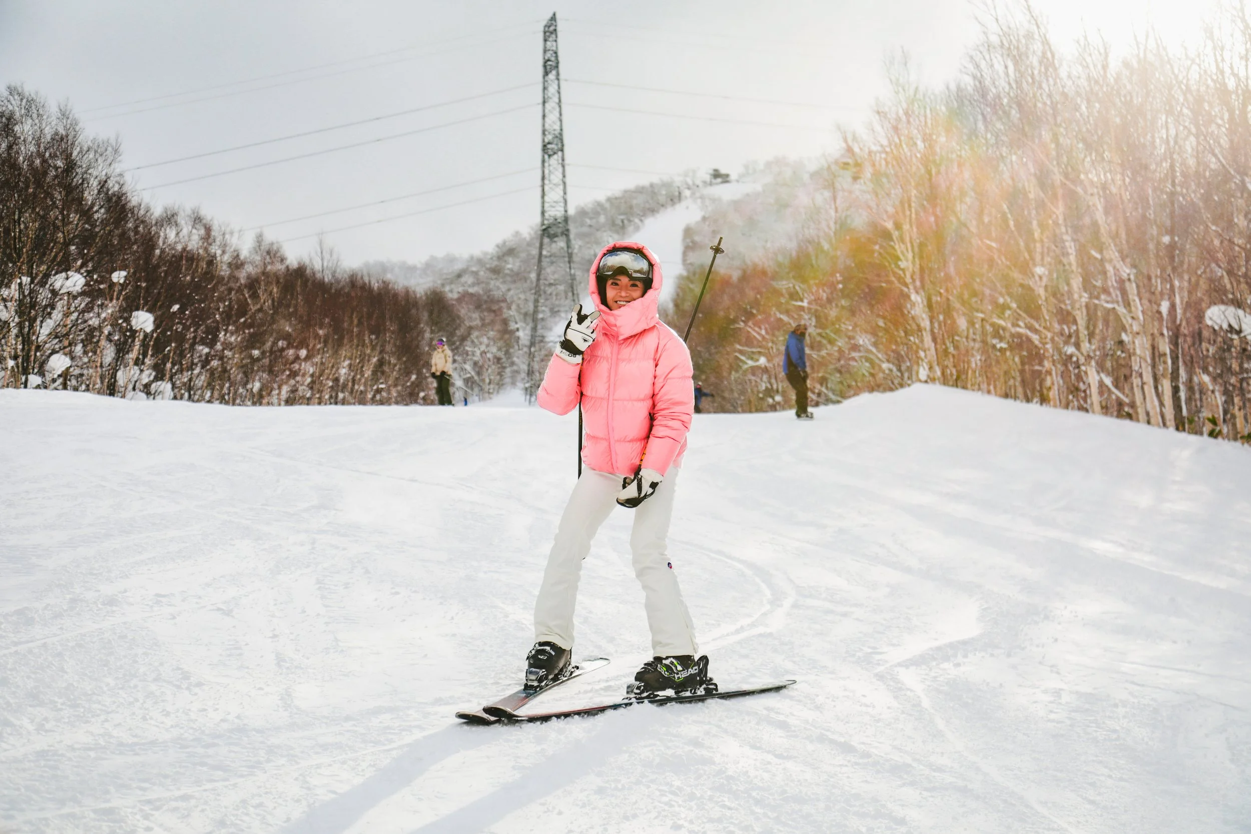 Beginner skier learning turning techniques during a ski lesson in Niseko and Rusutsu, Japan.