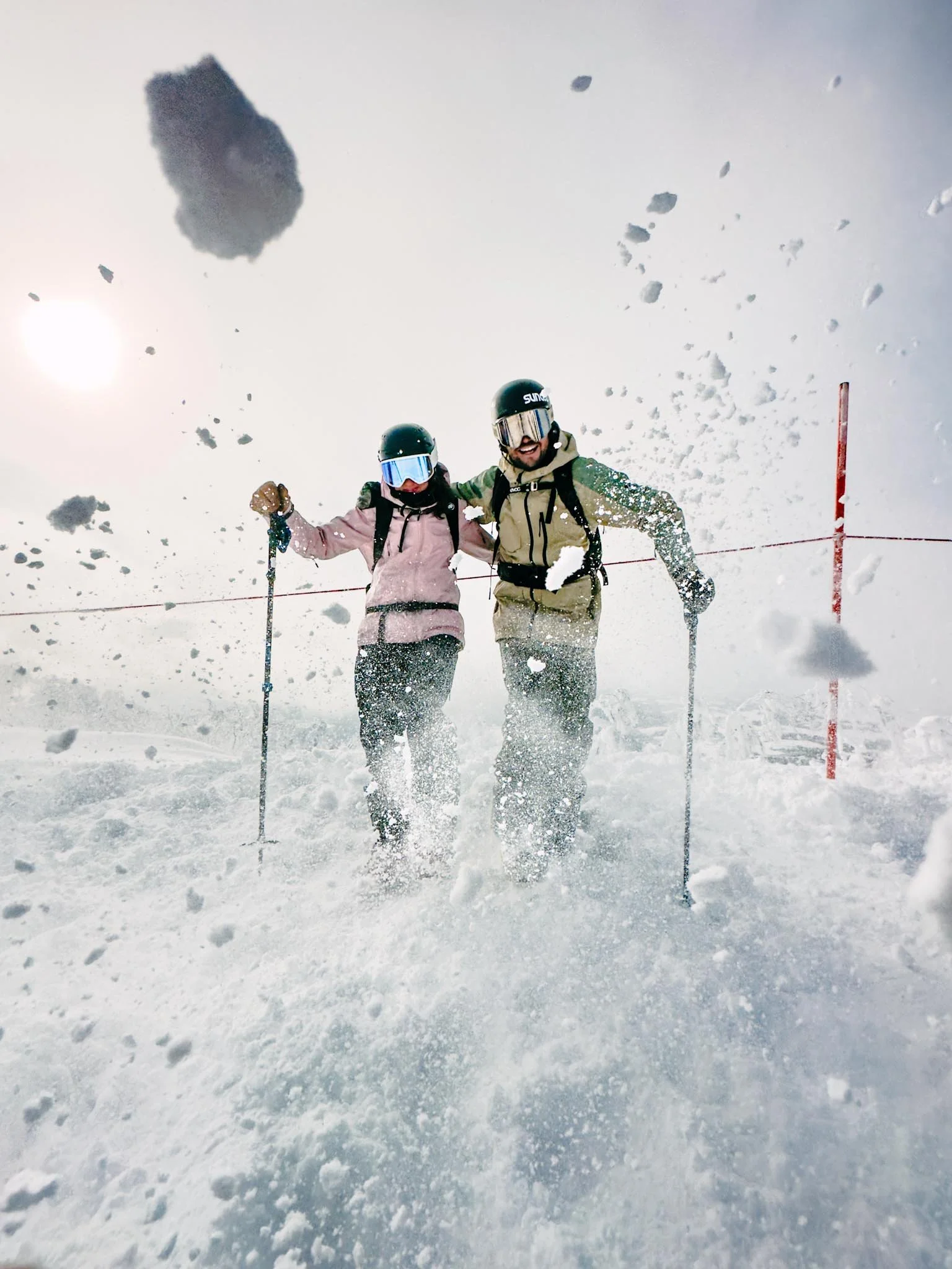 Couple kickcing snow to camera Kiroro