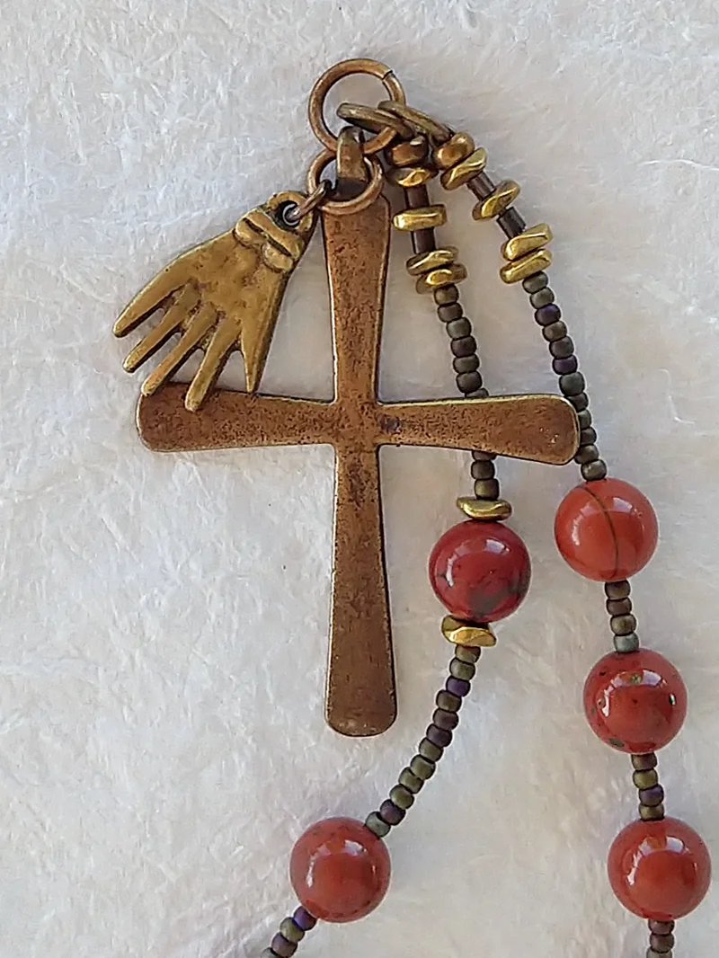 Charity, chaplet handmade with Milagro of an open hand, by Still Stone and Moss Prayer Bead Art. Detail.