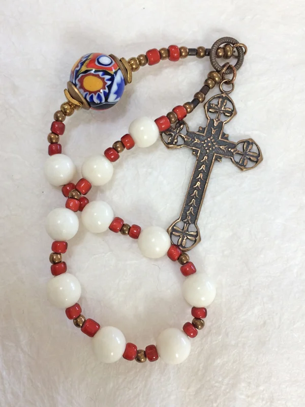 Saint Brigid's Fire, chaplet handmade of bone and Venetian glass, by Still Stone and Moss Prayer Bead Art. Full view.