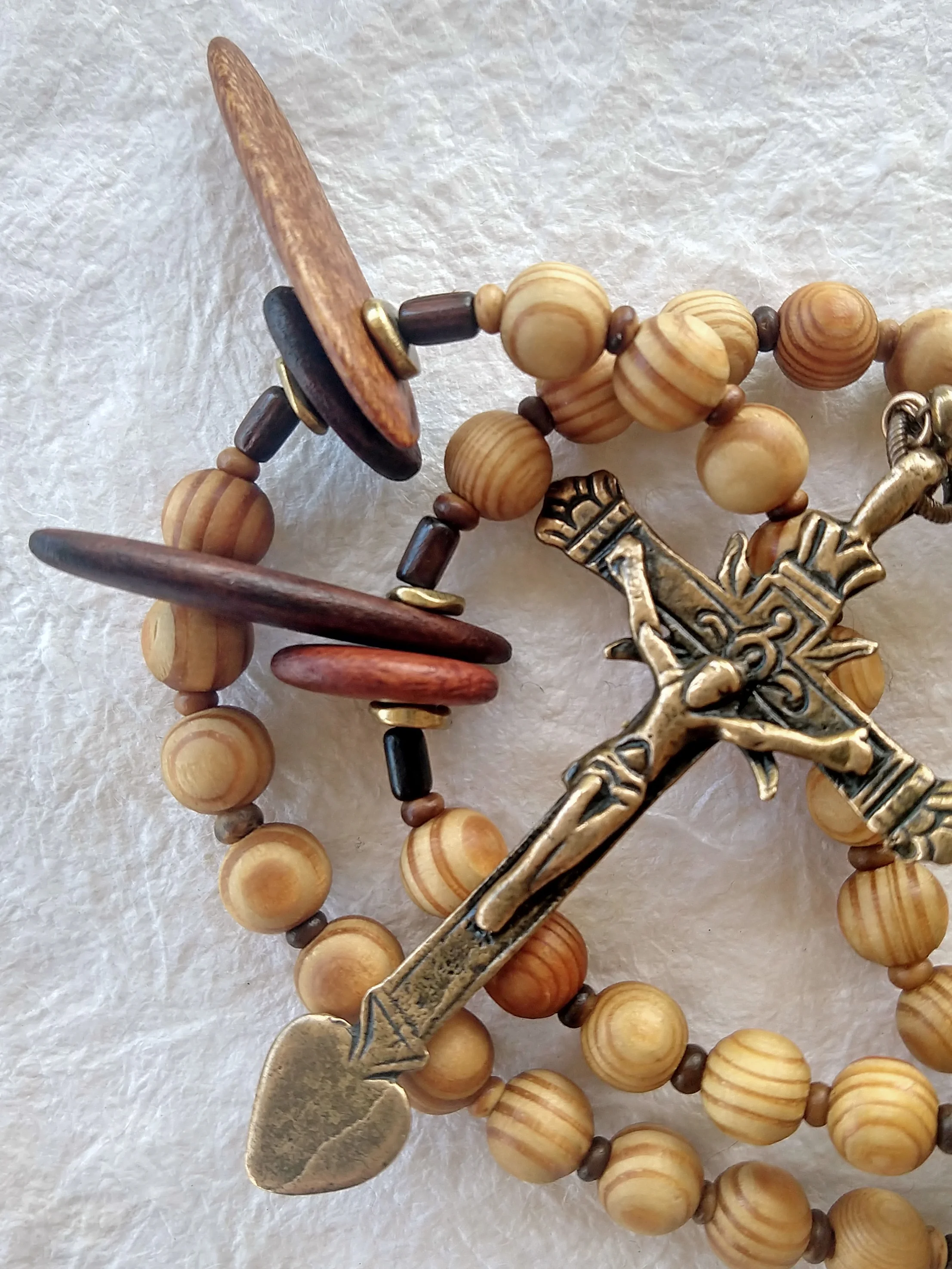 Mixed Woods rosary, variation 4, Latin American crucifix, handmade by Still Stone and Moss Prayer Bead Art, detail view.