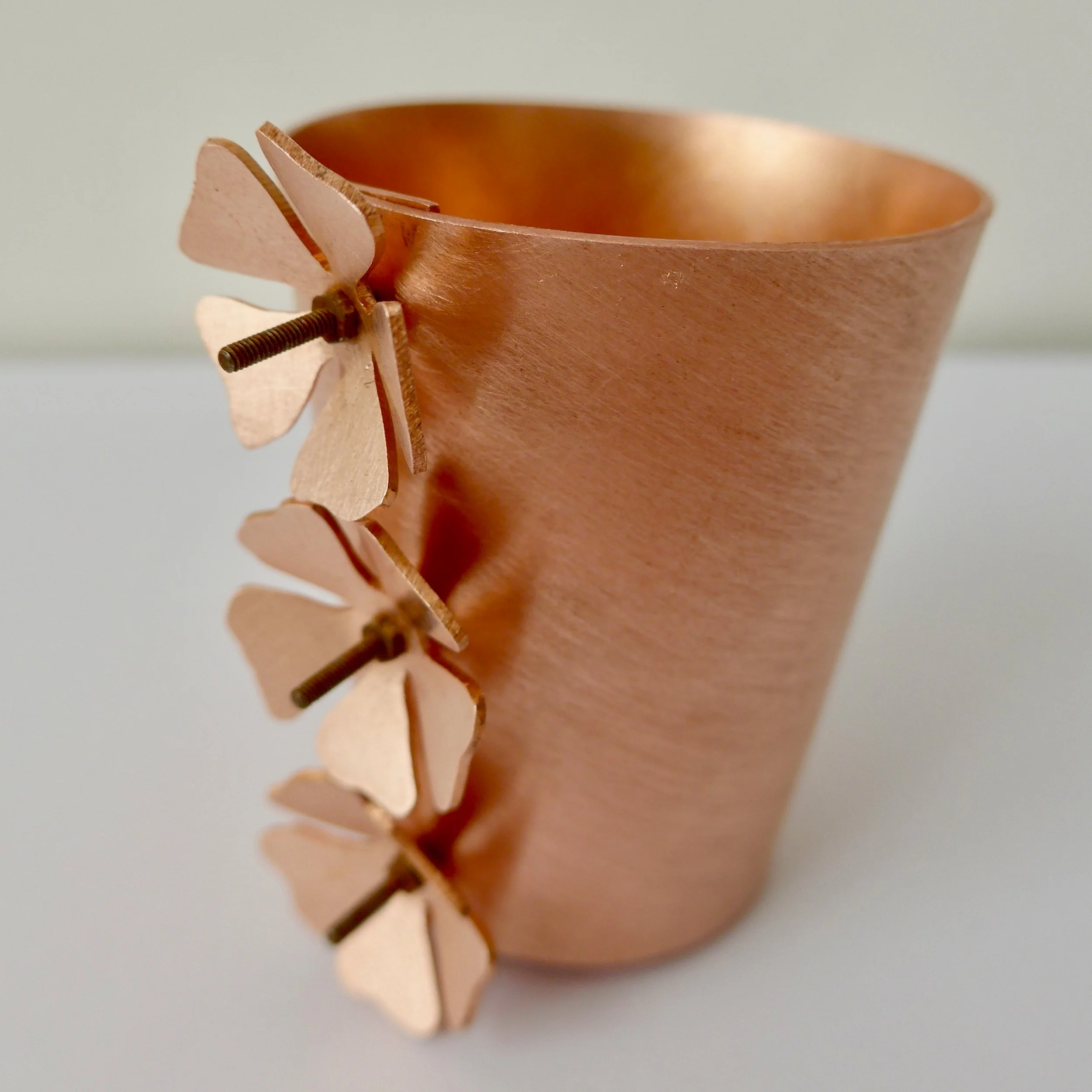 The challenge was to make this small copper vessel watertight using enamel rather than solder.