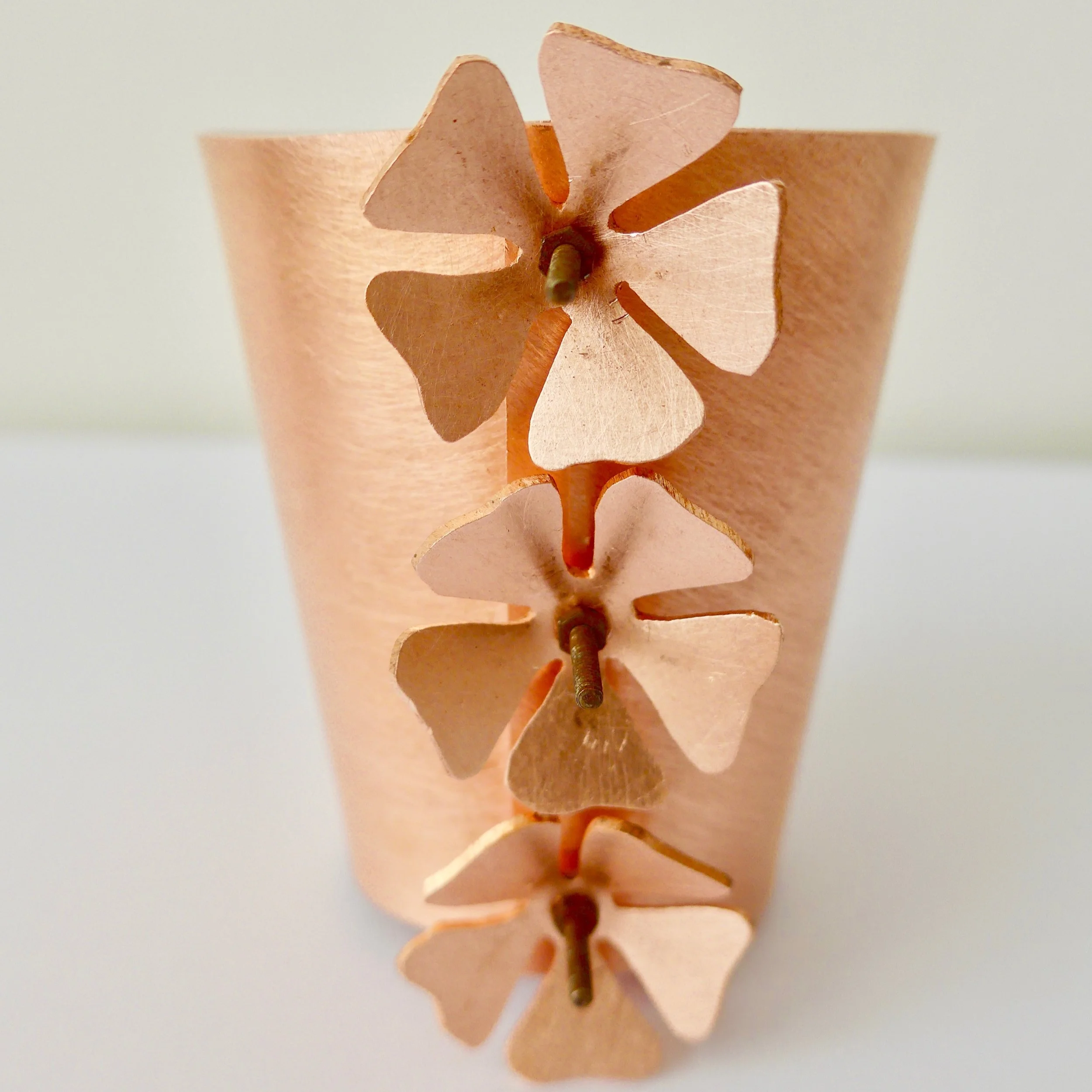 The body is a truncated cone, which was held secure with nuts and bolts.