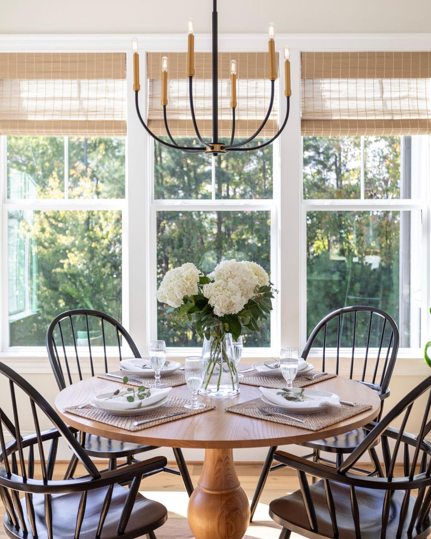 Just a cozy breakfast nook from our &ldquo;Mountain Views&rdquo; project. Here, the client&rsquo;s traditional Windsor dining chairs were repurposed and painted black to coordinate with a new table from @gatcreek . The modern chandelier and textured 