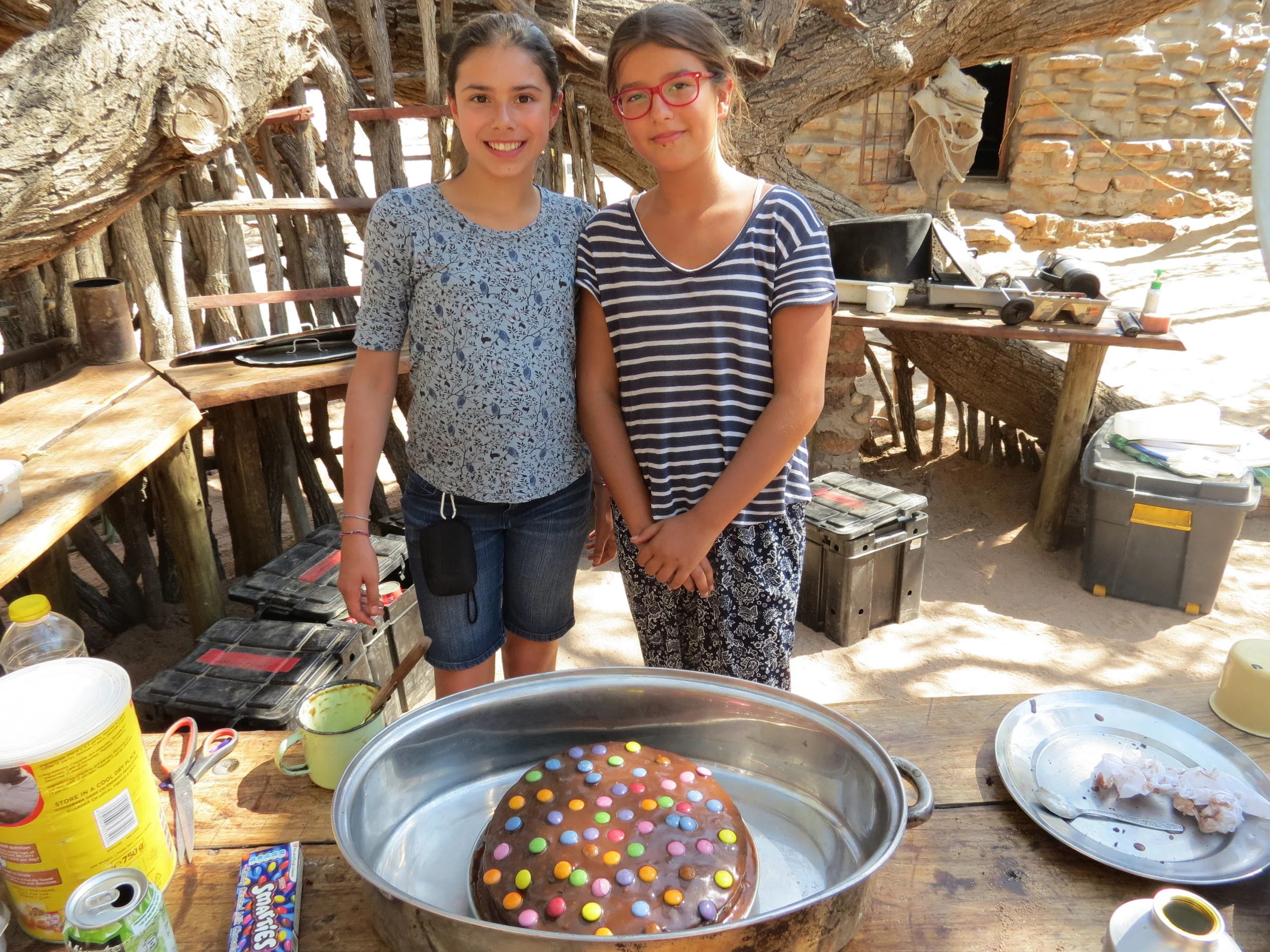 family_volunteers_cooking_on_fire.JPG