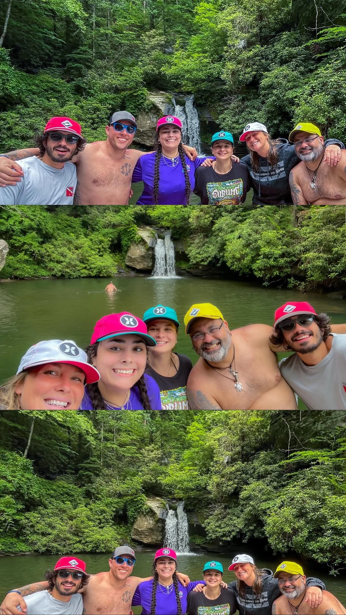Group of people smiling together in front of a waterfall, with some swimming in the water, surrounded by lush green trees.