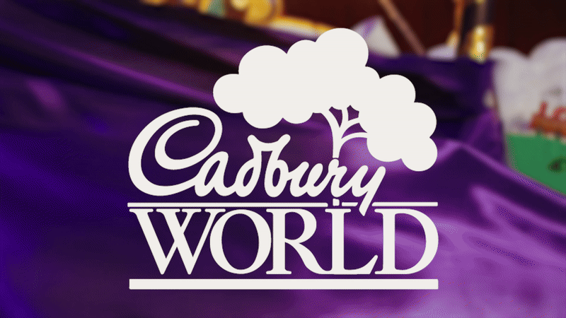 Animation of the Cadbury World logo overlaid over live action footage of a reveal of a handmade factory.
