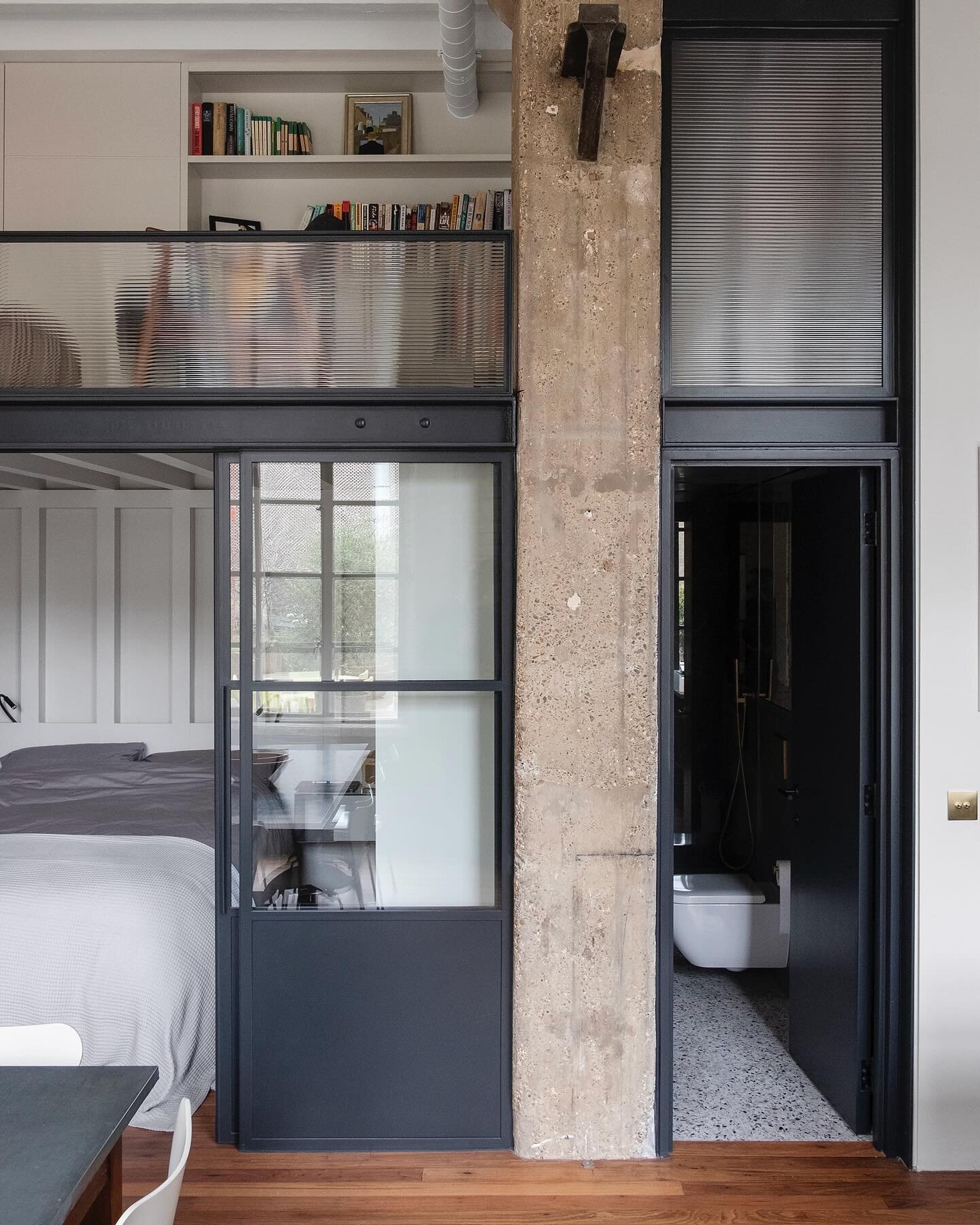 BANKSIDE LOFT

The new structure for the mezzanine is completely free-standing with the perimeter walls of the apartment, made from large sections of timber.

Steel crittall sliding doors and windows enclose the bedroom but allow the space to feel op