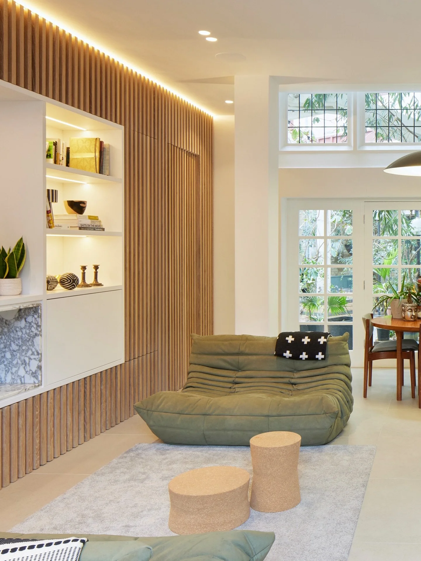 BOUNDARY ESTATE HOUSE

We clad one wall of the living room in reeded oak timber to bring texture and warmth, while cleverly concealing the bathroom door, hidden storage, and a marble fireplace surrounded by shelves for books and art.

All finishes we