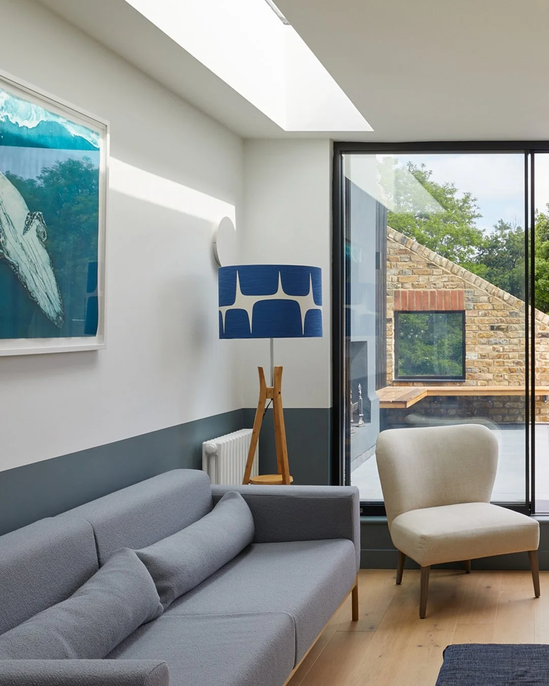 HARRY'S HOUSE

The living space is lifted into a new loft level, creating a bright, uplifting top floor with dual-aspect views and sunlight that dances across the walls through strip rooflights. Living space opens out directly onto the roof terrace a