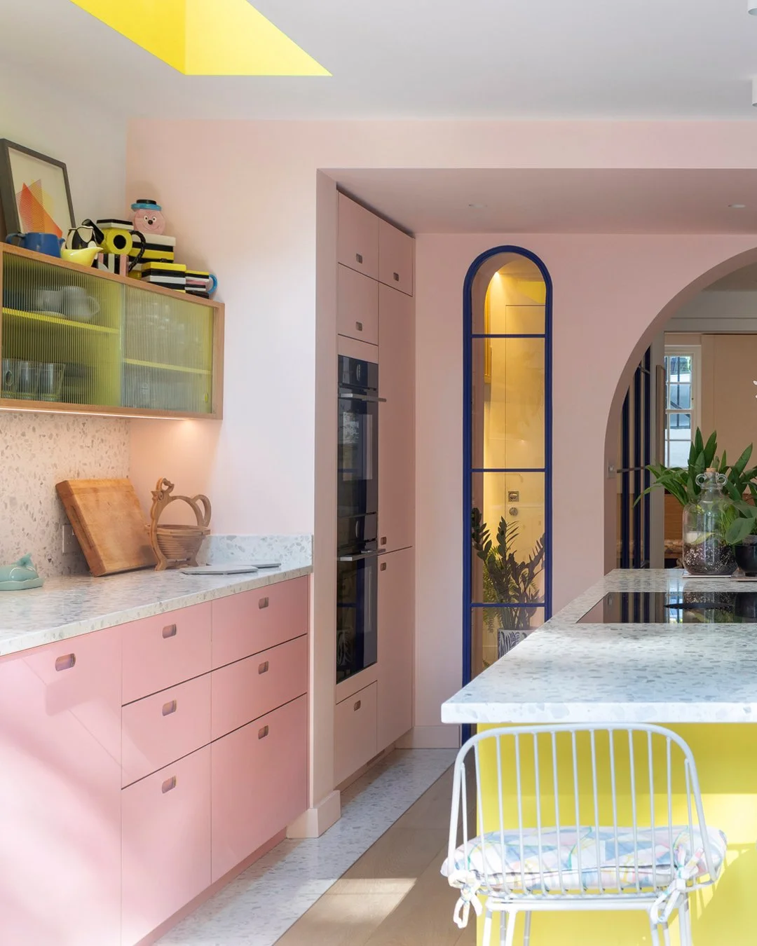 Vivid House 🌈 

The design for this project was shaped by the home&rsquo;s unusual side access and a staircase slicing through the heart of the lower ground floor. A bold arch between kitchen and dining cleverly conceals the stair, offering just a g