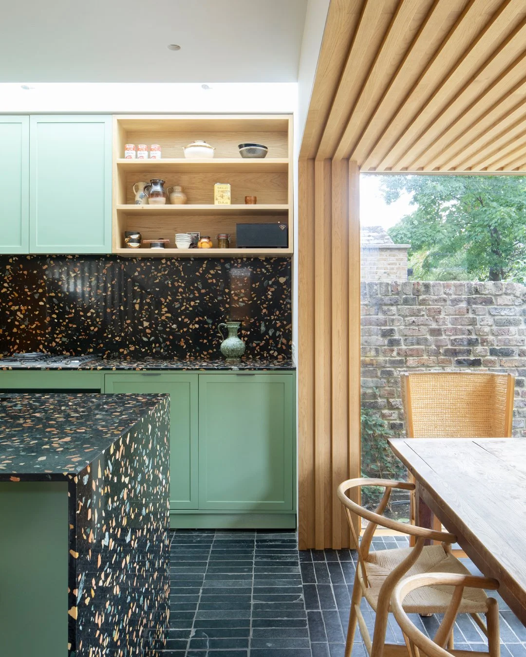 House in Hackney

The extension allows the kitchen and dining room to push further into the garden, making the most of the views and light. A strip rooflight over the kitchen wall units brings light deep into the space and washes the kitchen with sun