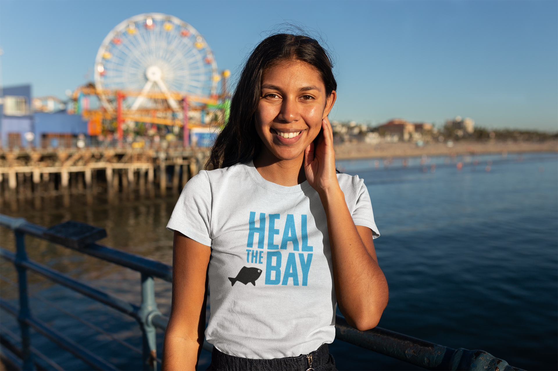 t-shirt-mockup-of-a-woman-on-the-santa-monica-pier-18214.png