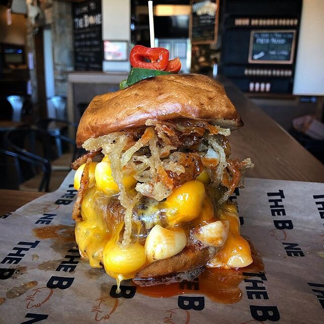 Mac-n-Cheese Burger: 1/2 lb. ground brisket and chuck burger, house Mac and cheese, fried onion straws, honey bourbon wing sauce 🔥🔥🔥 This burger is available this weekend in Gainesville. 
Manassas and Gainesville locations are OPEN Saturday 11-8 a