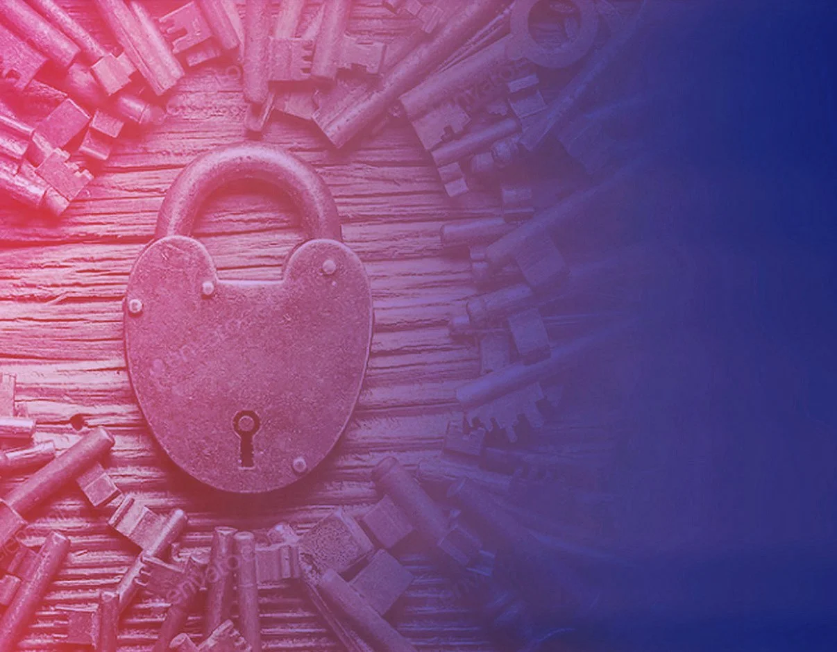 A rusty heart-shaped lock surrounded by various old keys on a wooden surface, with a red and blue filter overlay.
