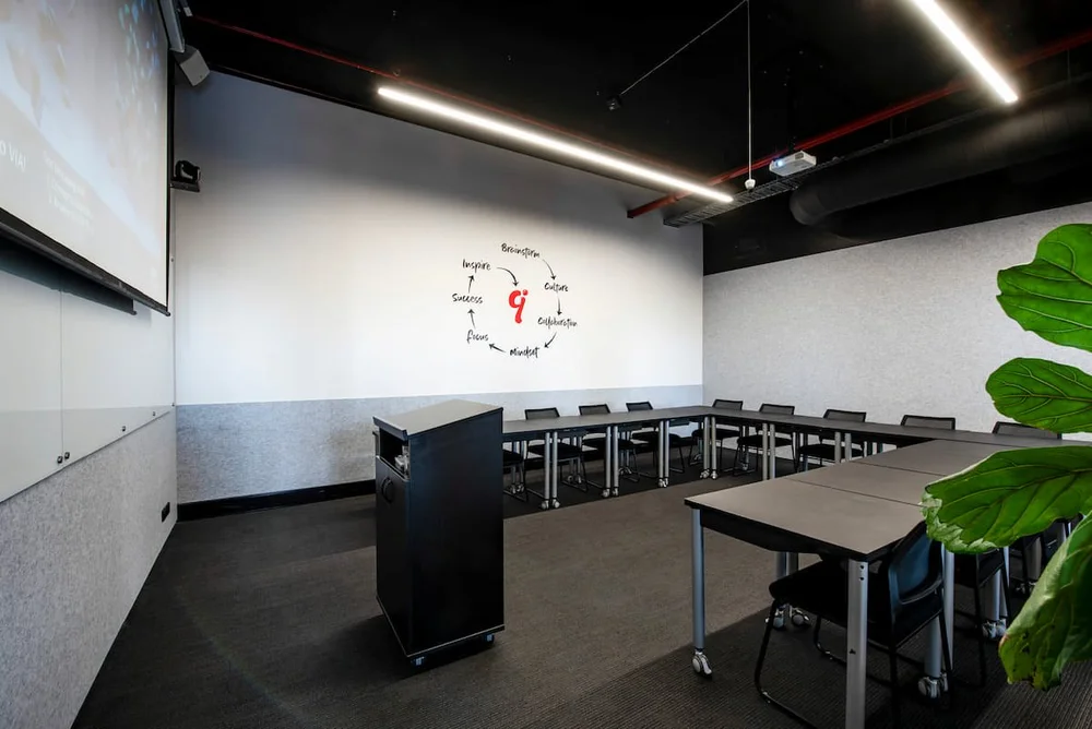 The Pool Room at Inspire9, a large training and conference room for hire in Richmond, Melbourne, with projector, lectern and modular seating.
