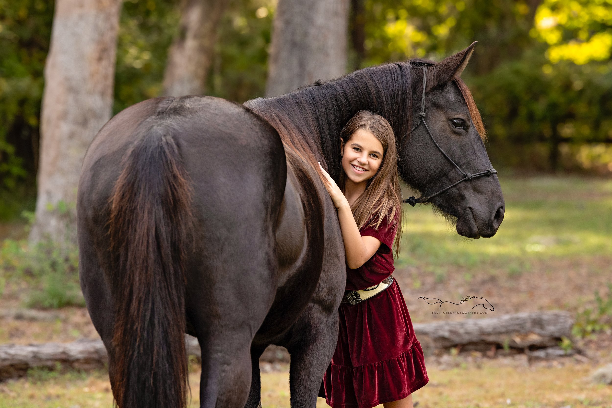 preteen girl stands with her horse for portraits