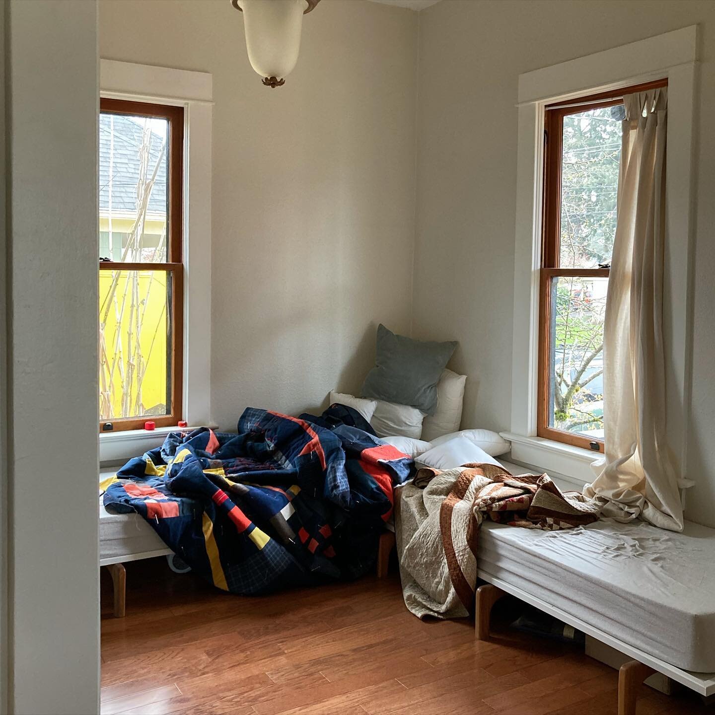 One of the most unfinished rooms of the house featuring my patented decor style, a-quilt-in-progress on any available surface. Not to be outdone by our neighbor&rsquo;s yellow box truck, and the world&rsquo;s ugliest light fixture &mdash; still someh