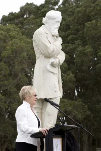 Sandra Faulkner next to the statue she re-discovered