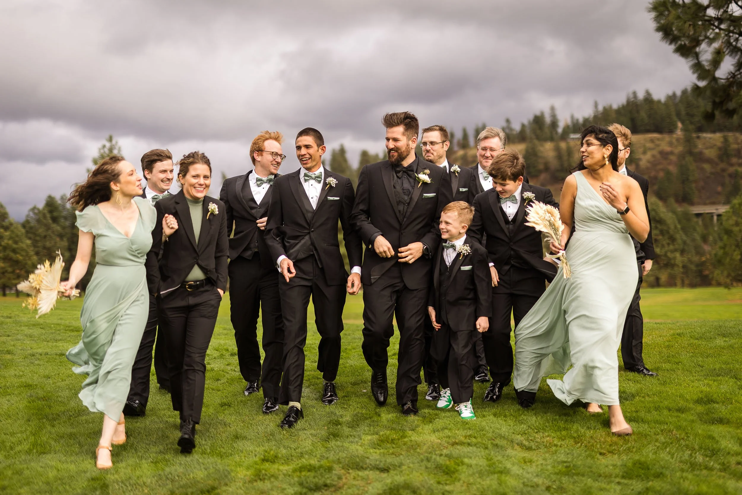 Bridal party walking outside in a storm.