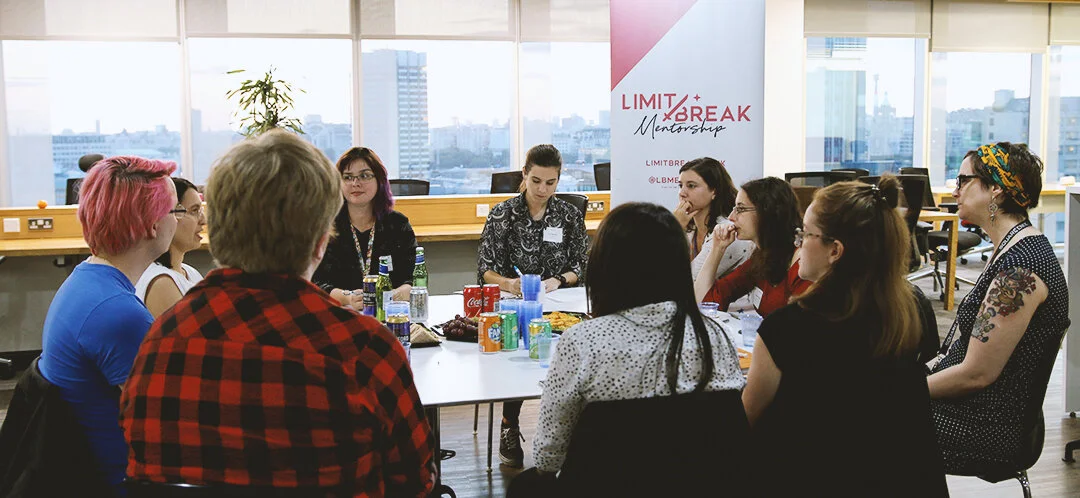 A group of people sat around a large table