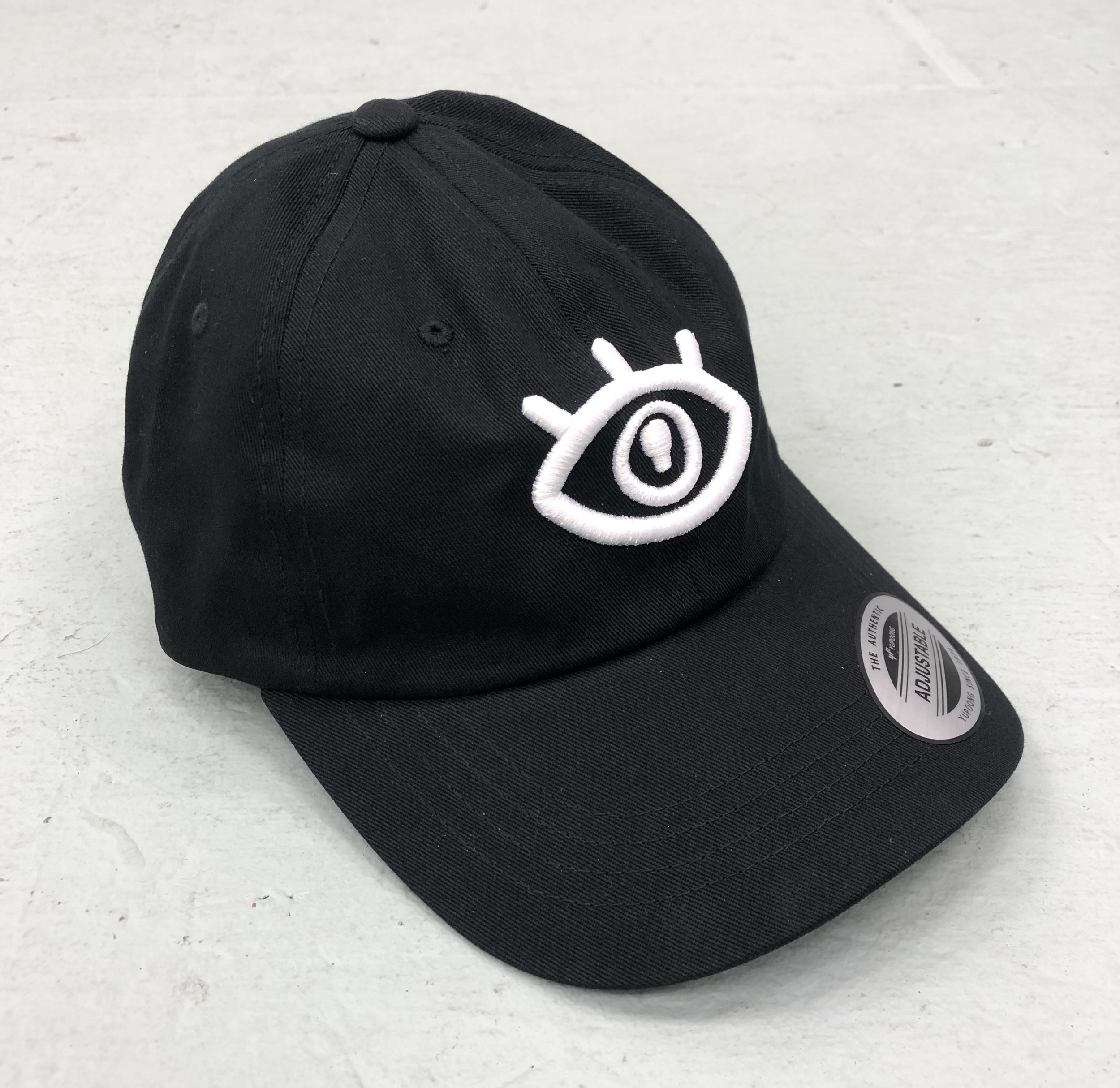 BLACK WHITE EYE DAD HAT.jpg