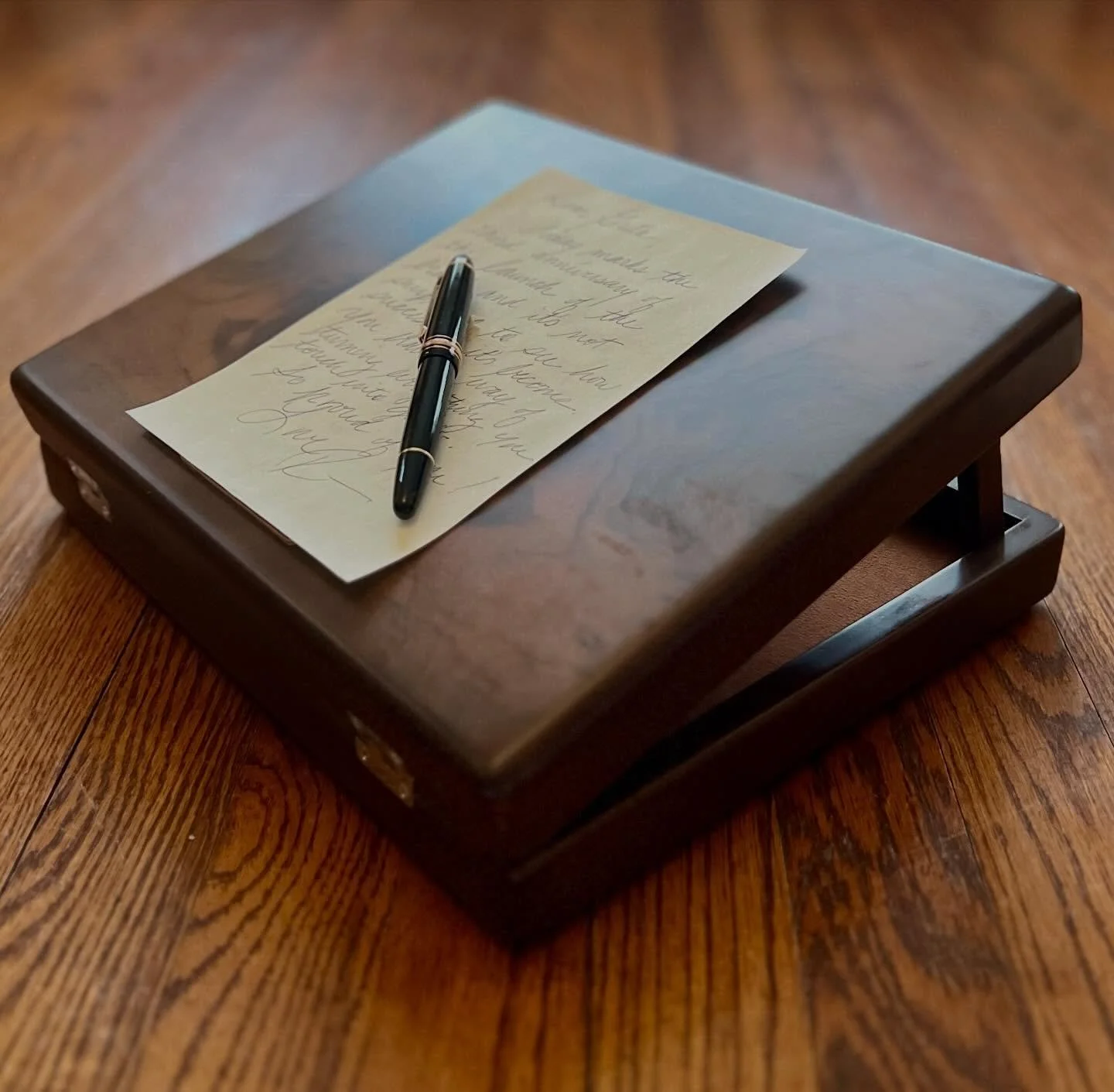 I just unpacked my writing box by Galen Leather, which will safely house my everyday pens and paper but it also converts into a portable, antique-style lap desk by raising built-in wooden prongs to prop up the lid and create a 15-degree angled writin