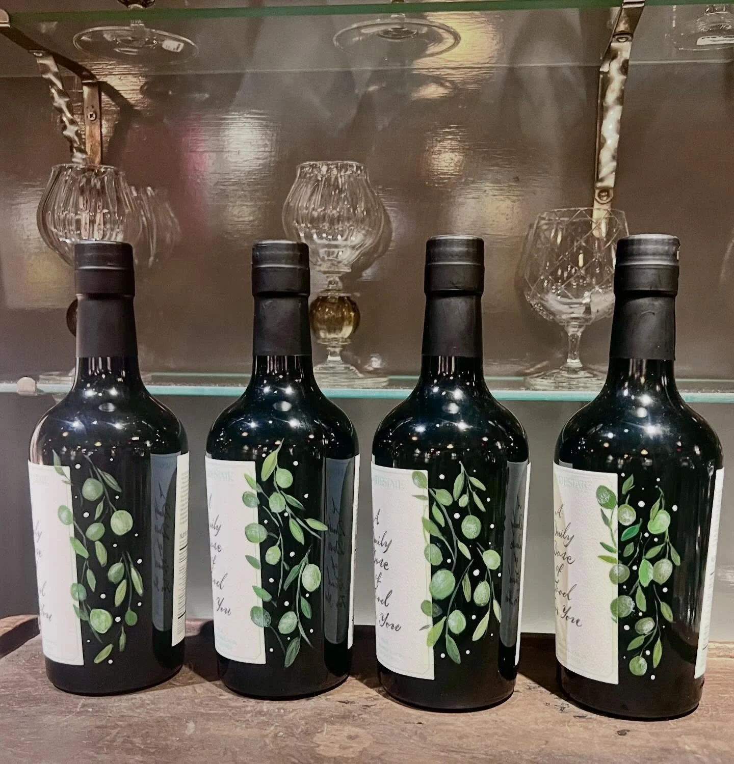 Hand-painted Flamingo Estates olive oil bottles, pyrographed cutting boards and bottle personalization for Haven Well Within.