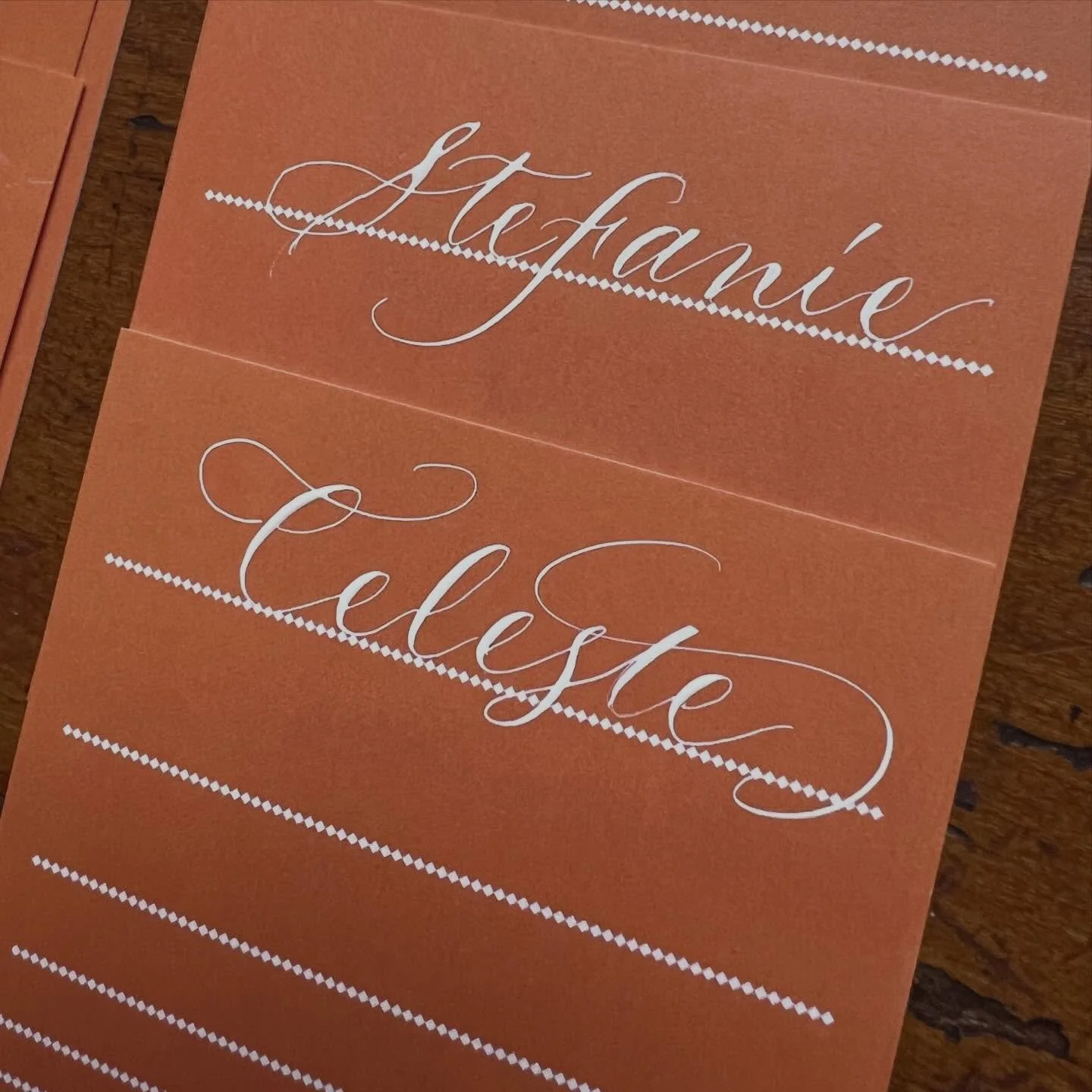 Menus for an event last Friday night in a hand that&rsquo;s looser and less formal than what I normally do. Nothing beats white ink against a colored background, IMO.